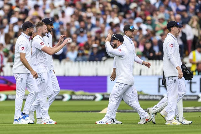 England’s Gus Atkinson (second from left) celebrates the wicket of West Indies’ Shamar Joseph (Steven Paston/PA)