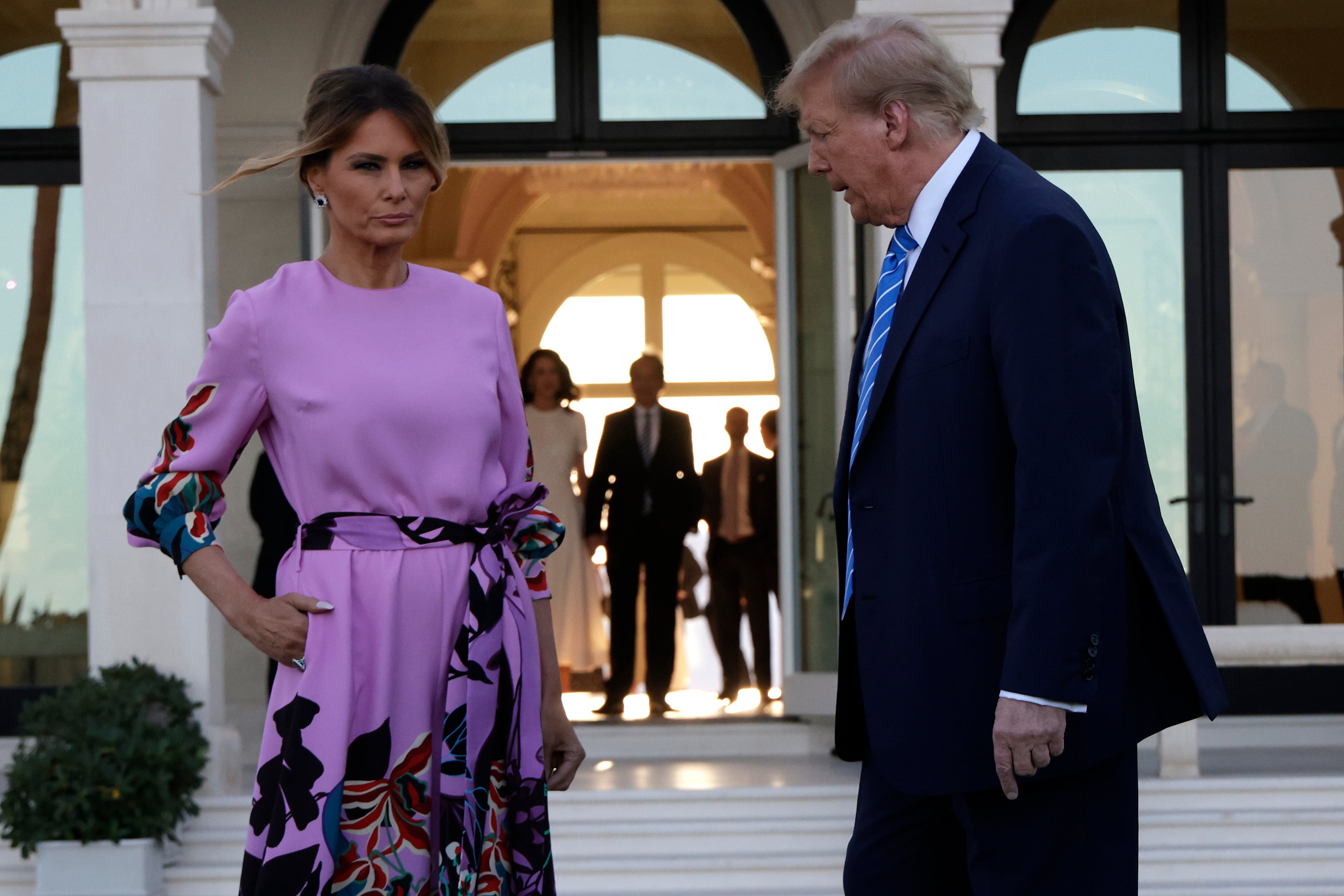 Republican presidential candidate, former US President Donald Trump and former first lady Melania Trump arrive at the home of billionaire investor John Paulson on April 6, 2024 in Palm Beach, Florida