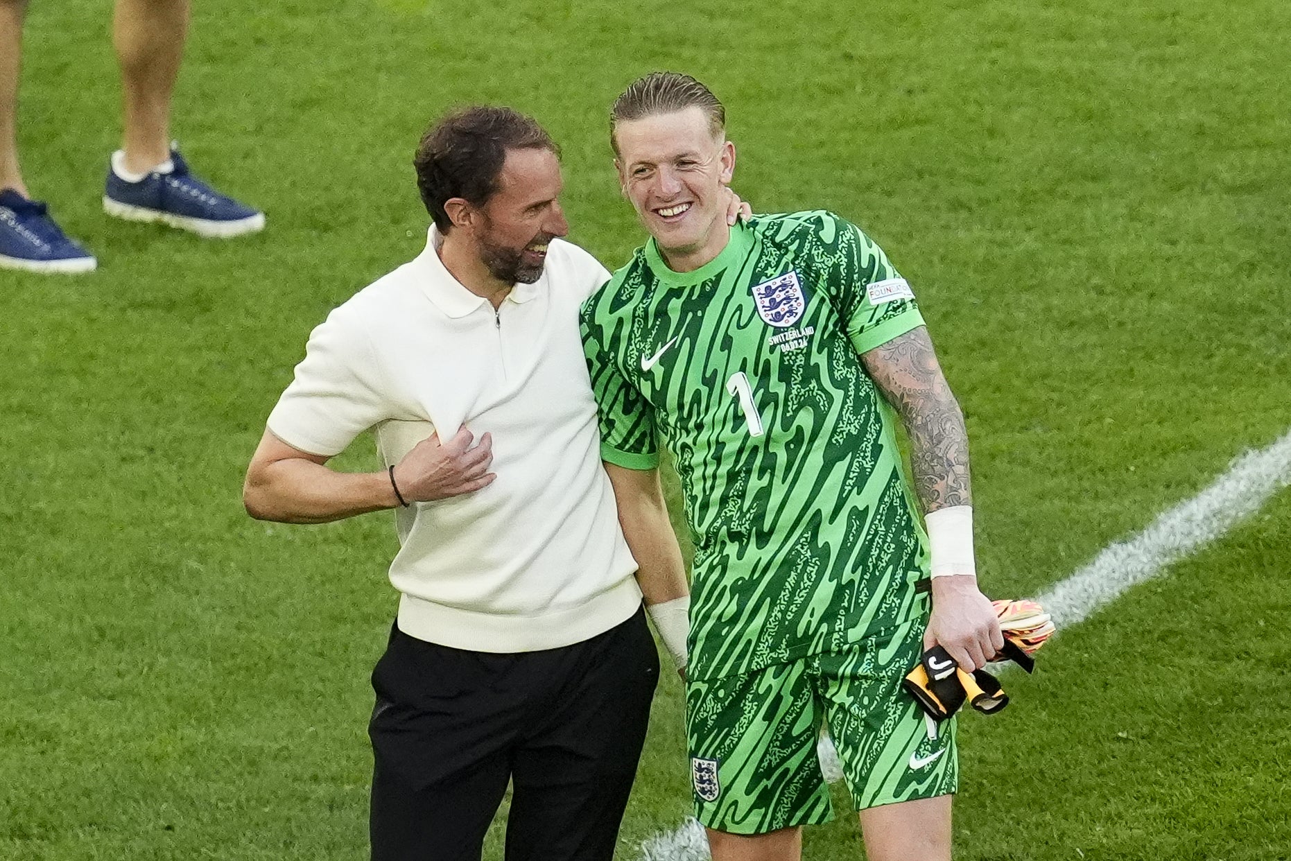 England manager Gareth Southgate celebrates with goalkeeper Jordan Pickford after the Switzerland game (Nick Potts/PA)