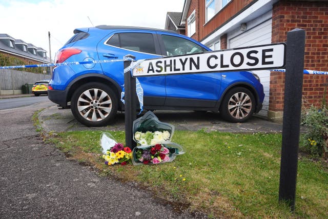 Floral tributes were left near to the police cordon at the scene in Hertfordshire (James Manning/PA)