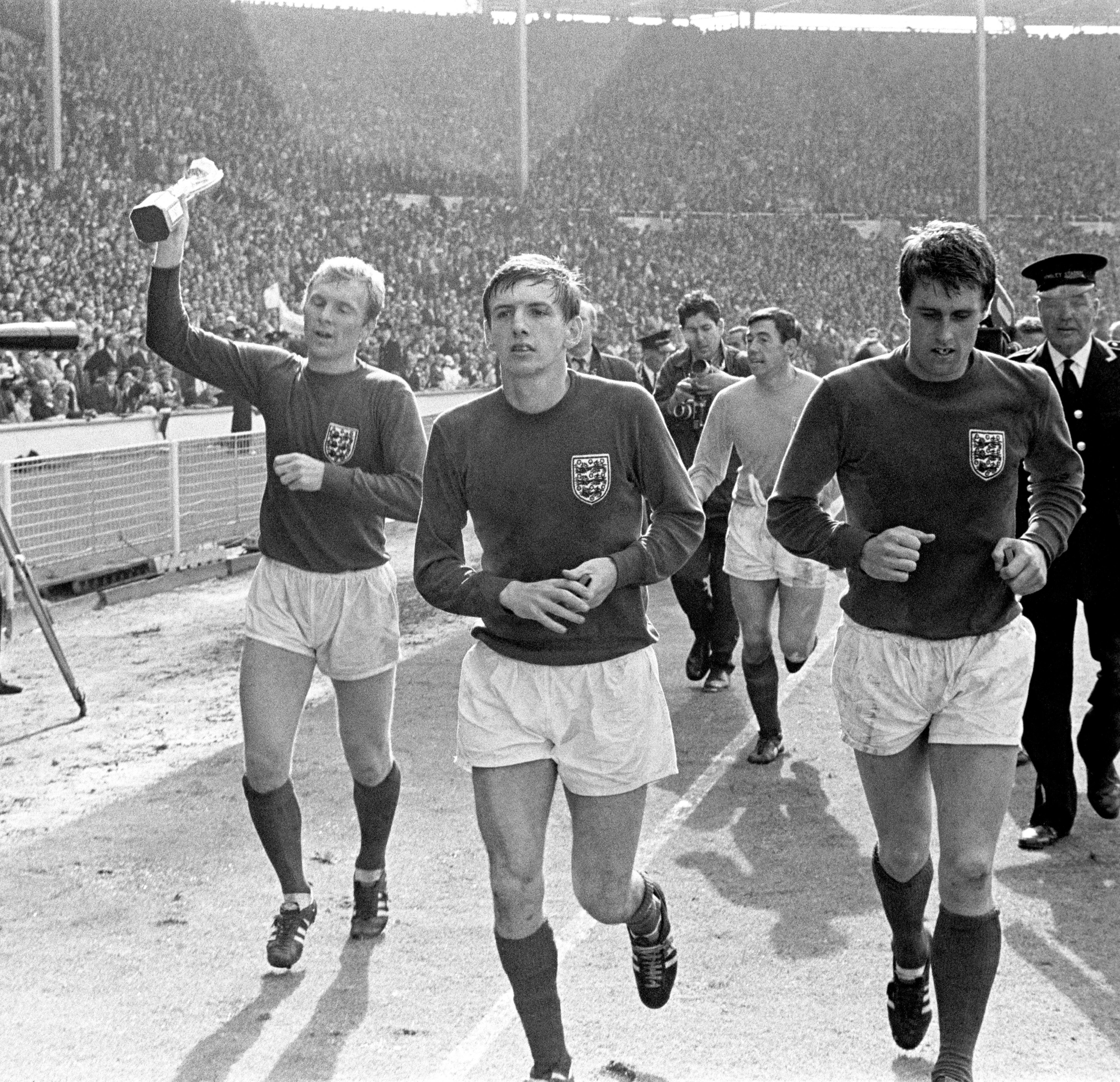 Martin Peters, centre, played alongside Bobby Moore, left, and Geoff Hurst, right, for West Ham (PA)