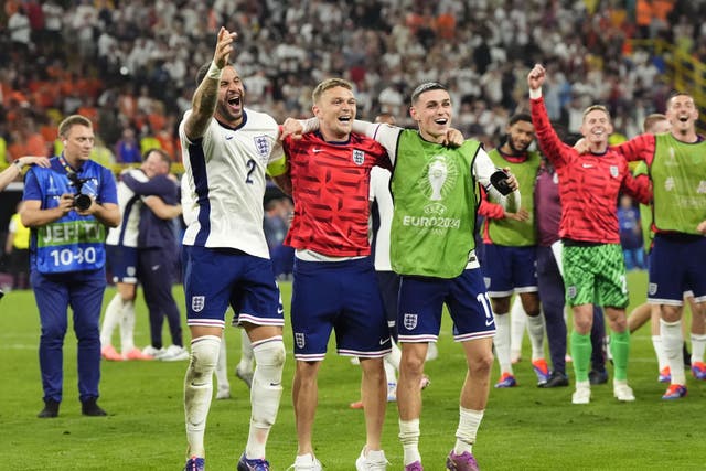 England’s Kyle Walker, Kieran Trippier and Phil Foden celebrate the win after the Euro 2024 semi-final match (Nick Potts/PA)