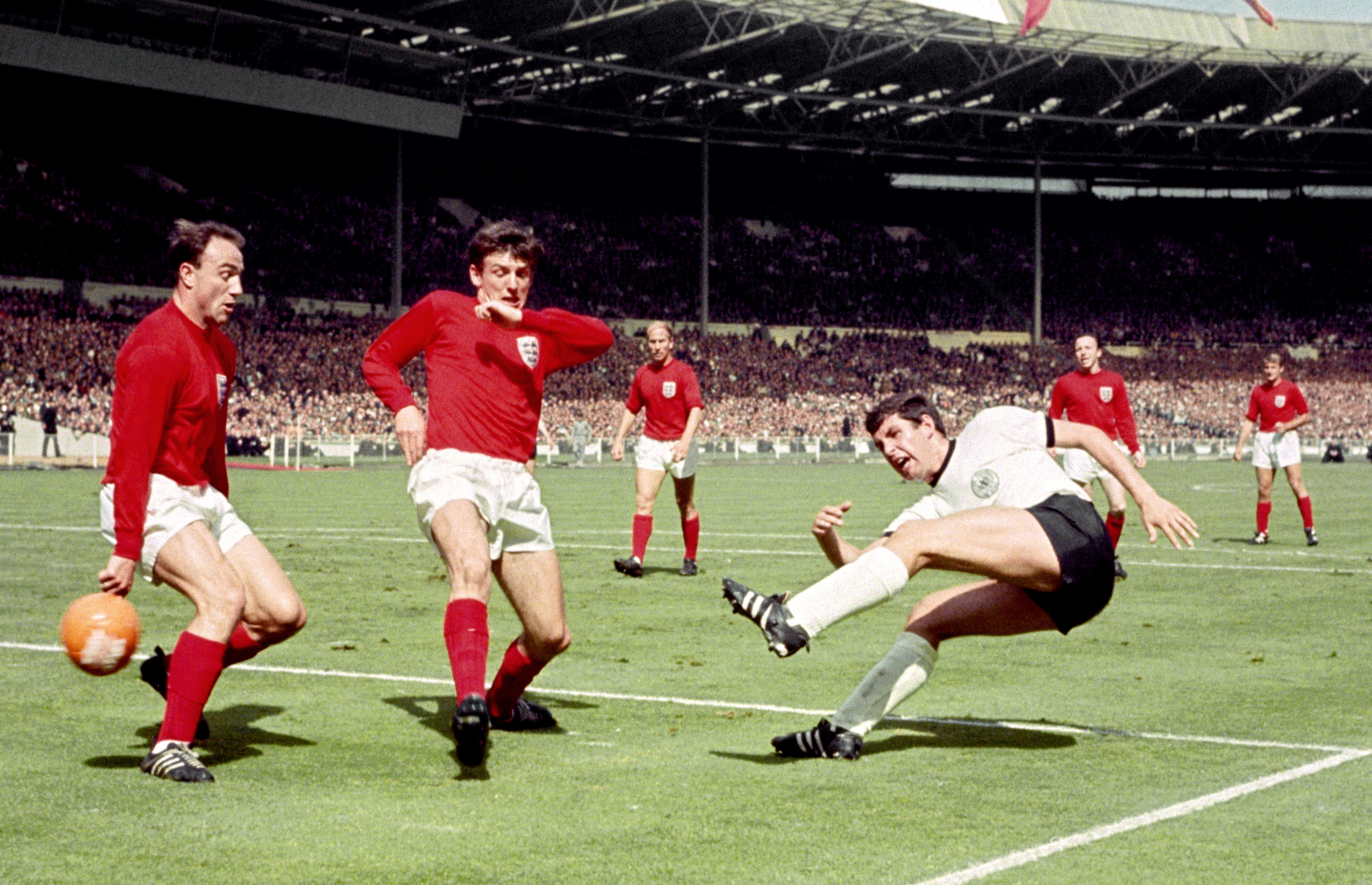 George Cohen, left, played more than 450 times for Fulham (PA)