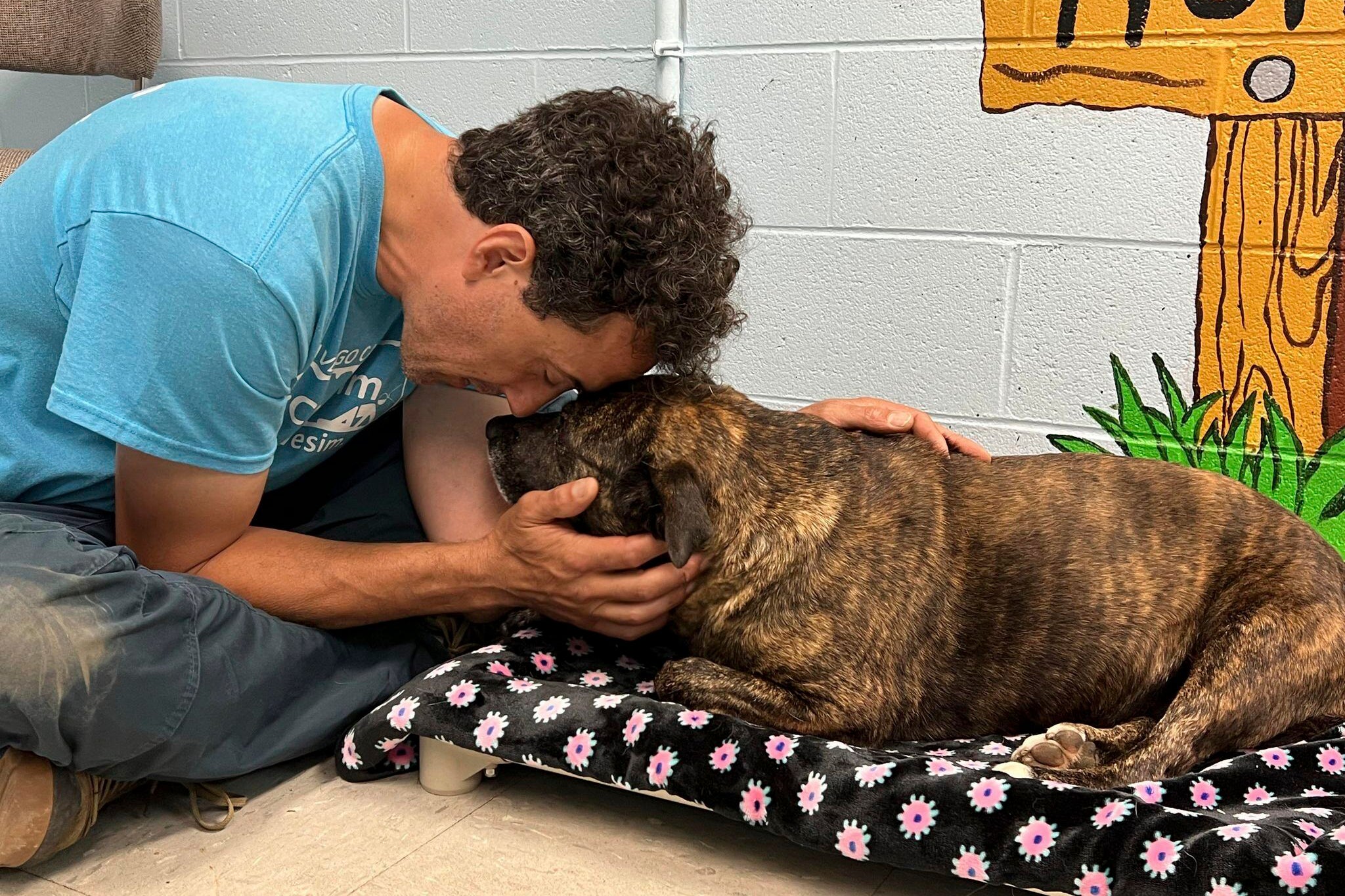 Jesse Rochette poses with Sparsy at the shelter in Pearisburg