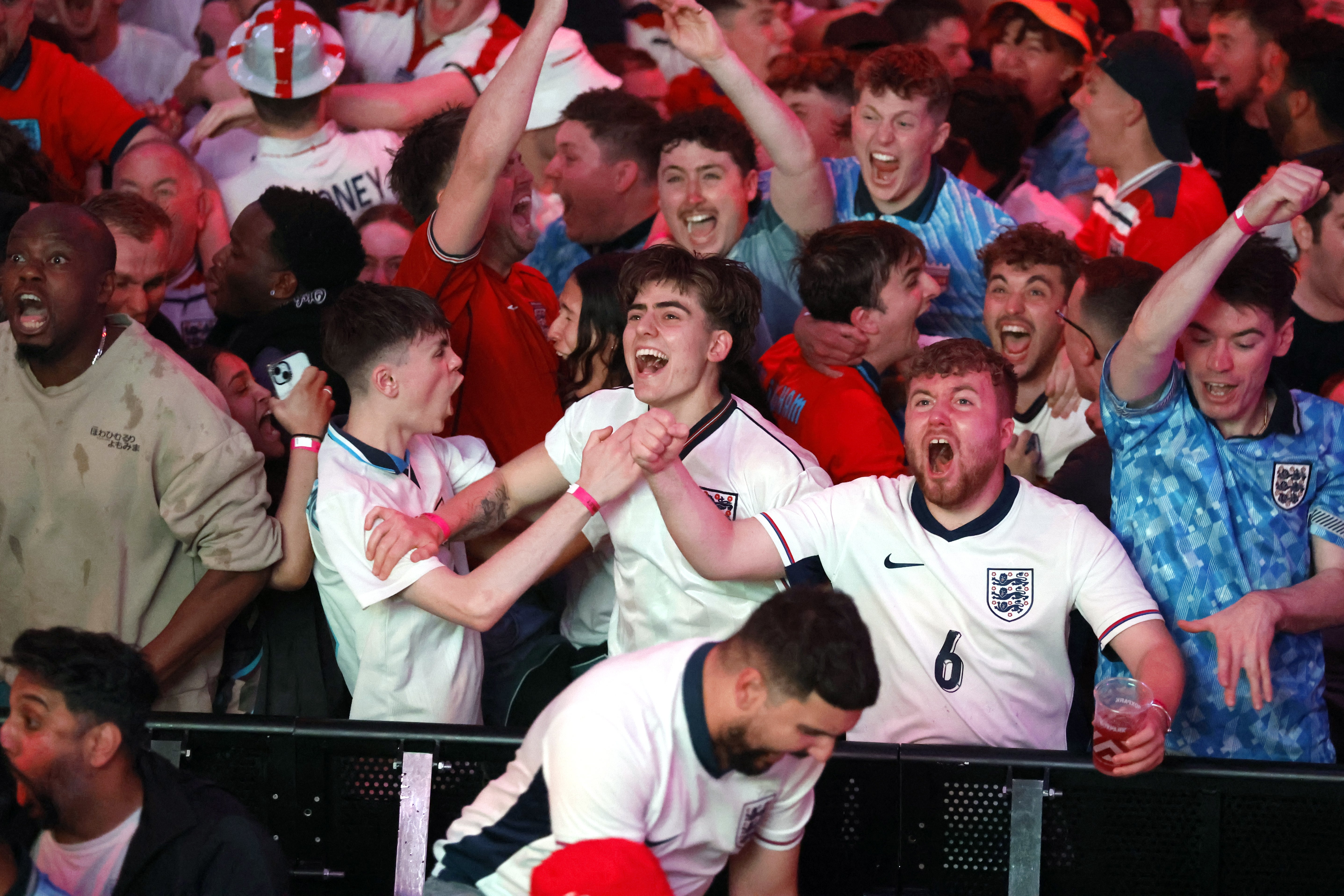 England fans celebrate the winner at BOXPark Wembley (Nigel French/PA)