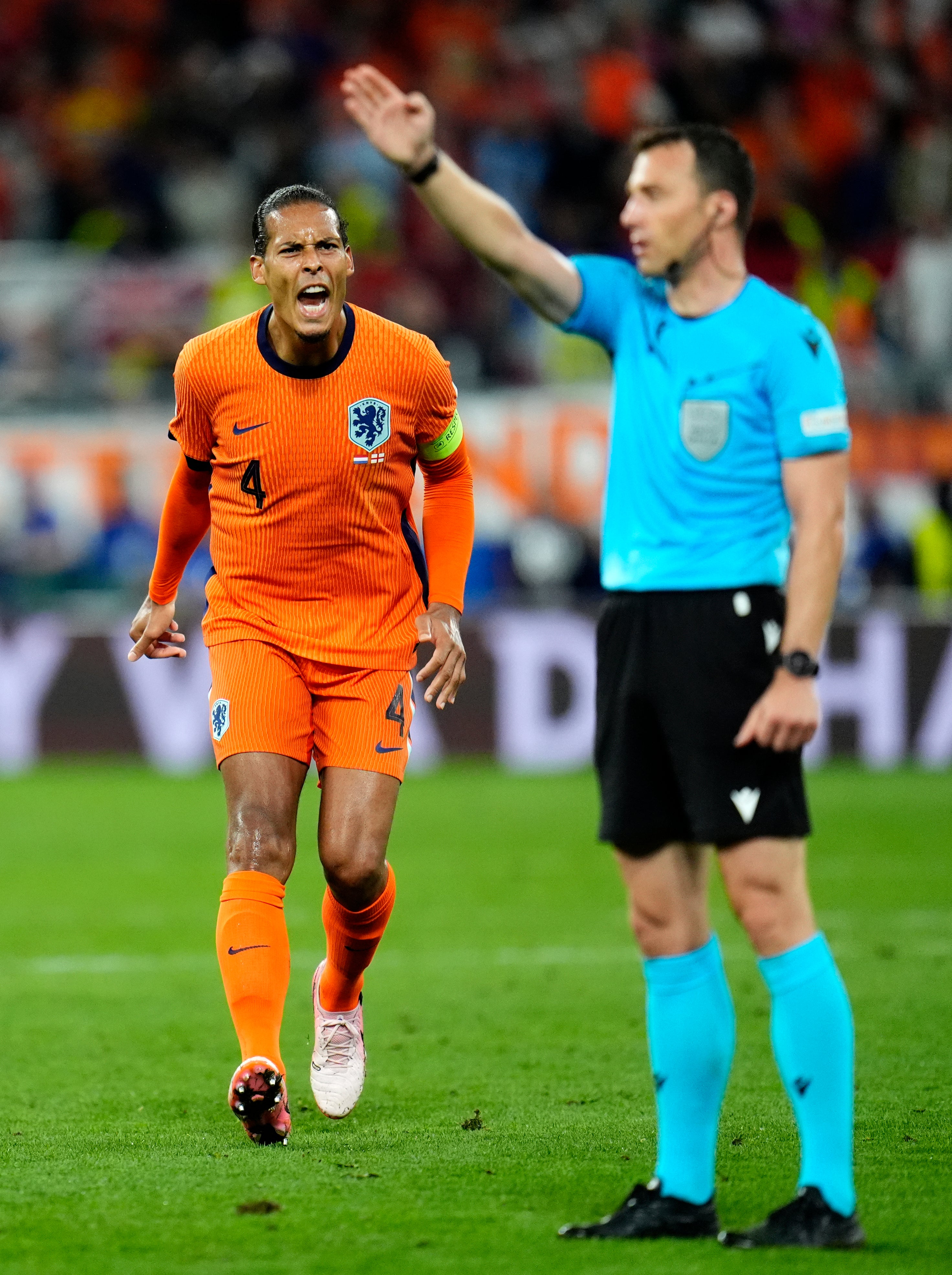 Netherlands's Virgil van Dijk appeals to referee Felix Zwayer