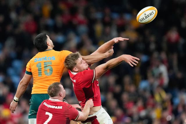 Australia’s Tom Wright, left, and Wales’ Taine Plumtree compete during the first Test (AP)