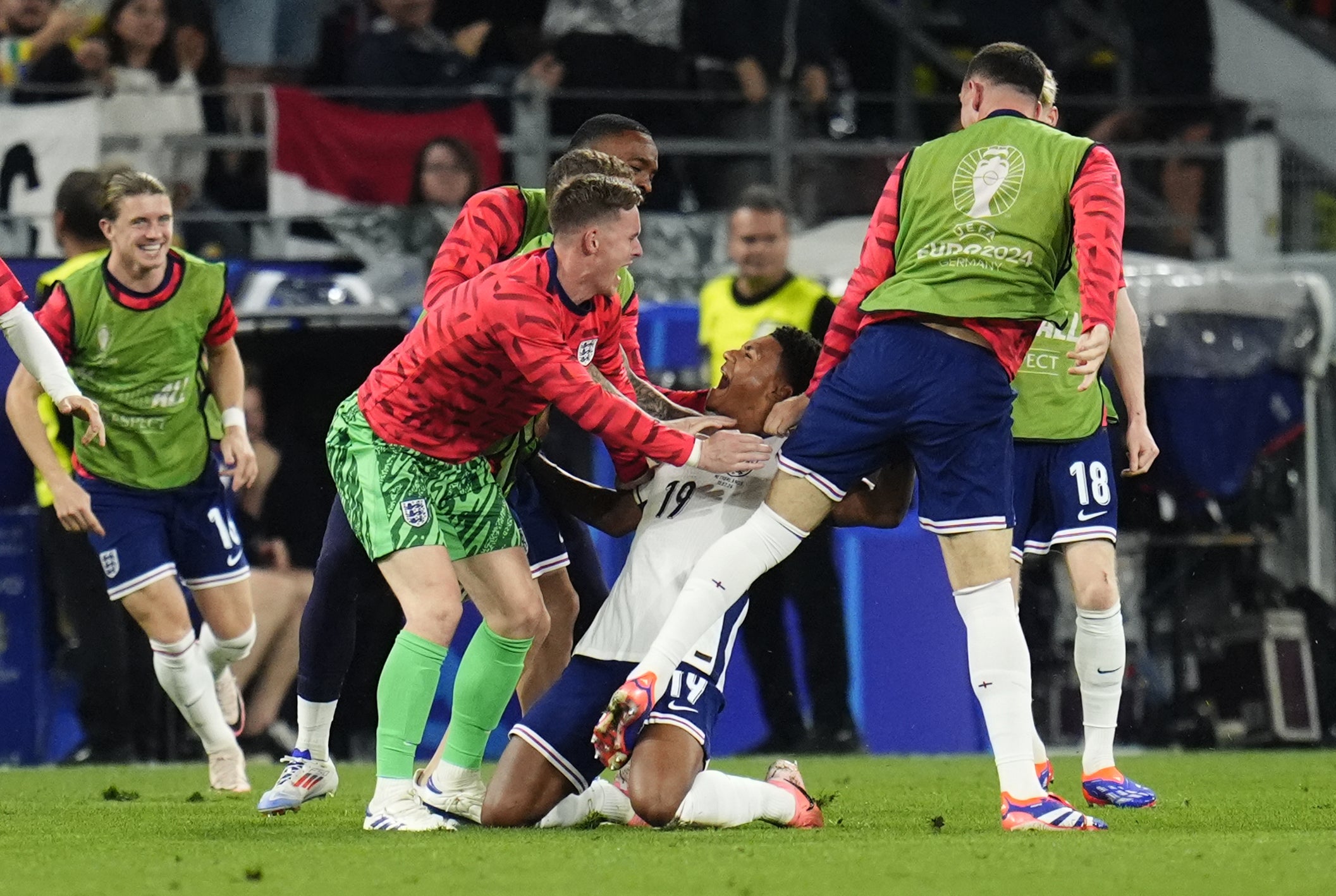 Ollie Watkins (centre) celebrates with the substitutes after scoring the last-gasp winner (Nick Potts/PA)