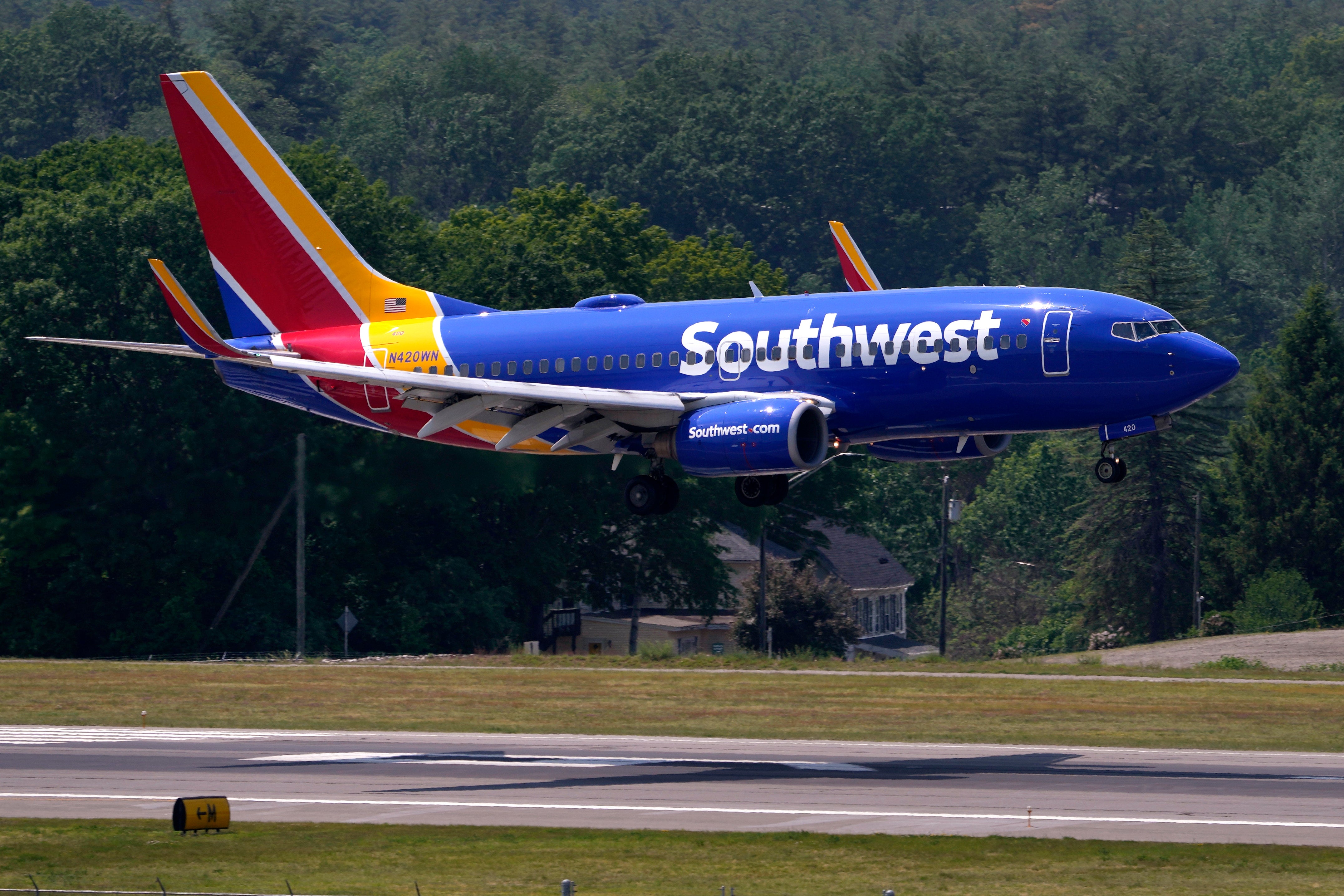 A Southwest Airlines Boeing 737 lands at Manchester-Boston Regional Airport. The airline says it is aware of a series of incidents involving exploding cans.