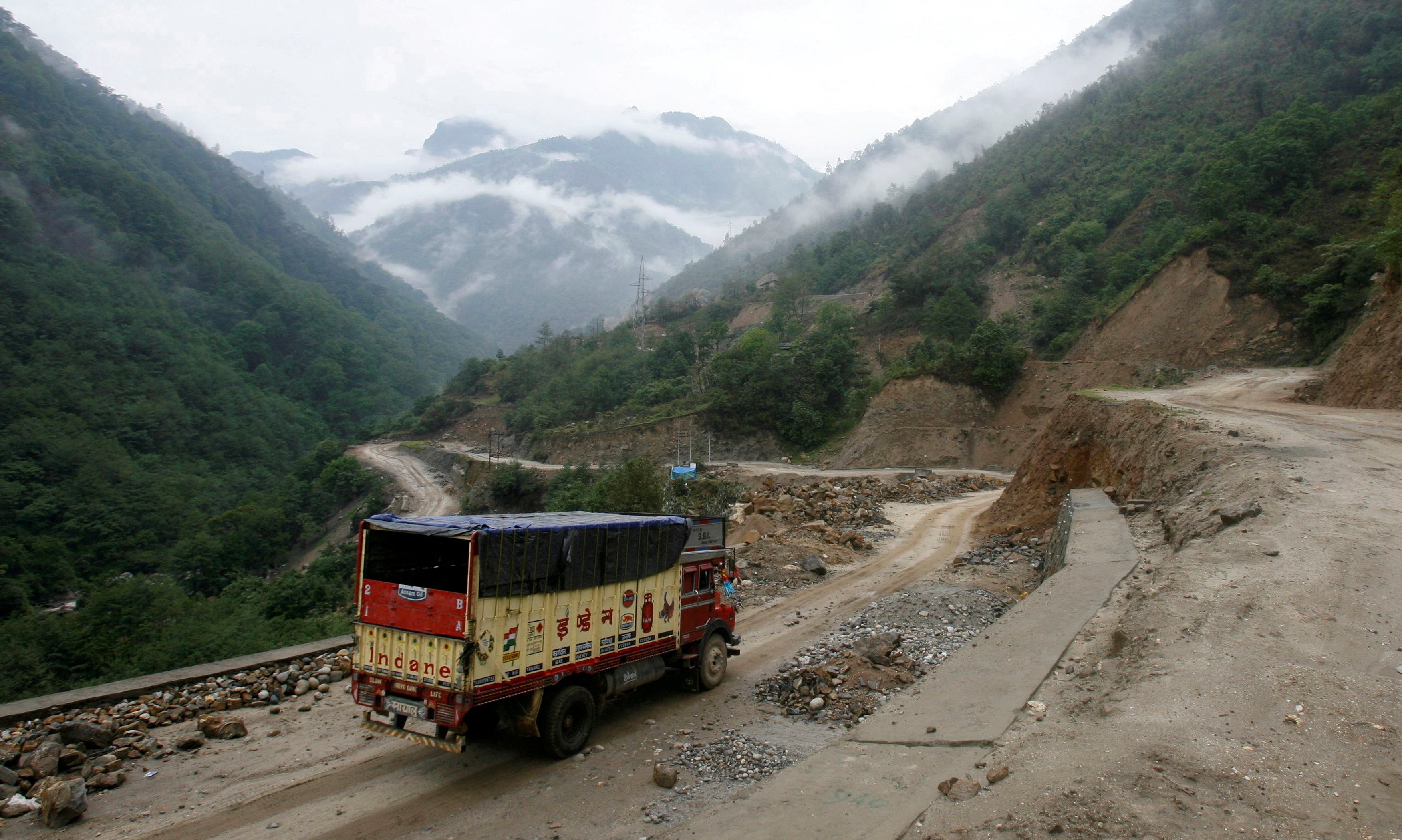 File. A truck drives along an Indian highway close to the Chinese border in the northeastern state of Arunachal Pradesh