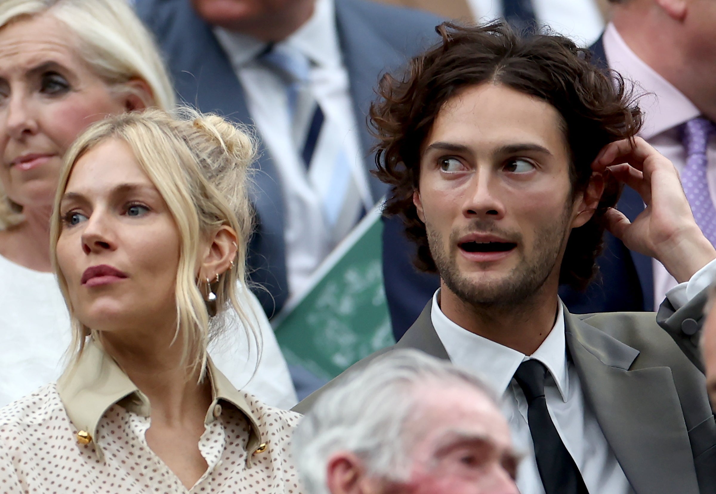 Sienna Miller and Oli Green sit in the royal box for day nine of Wimbledon