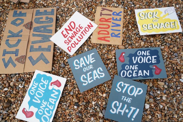 Placards for a protest against water firms’ poor pollution records (Gareth Fuller/PA)