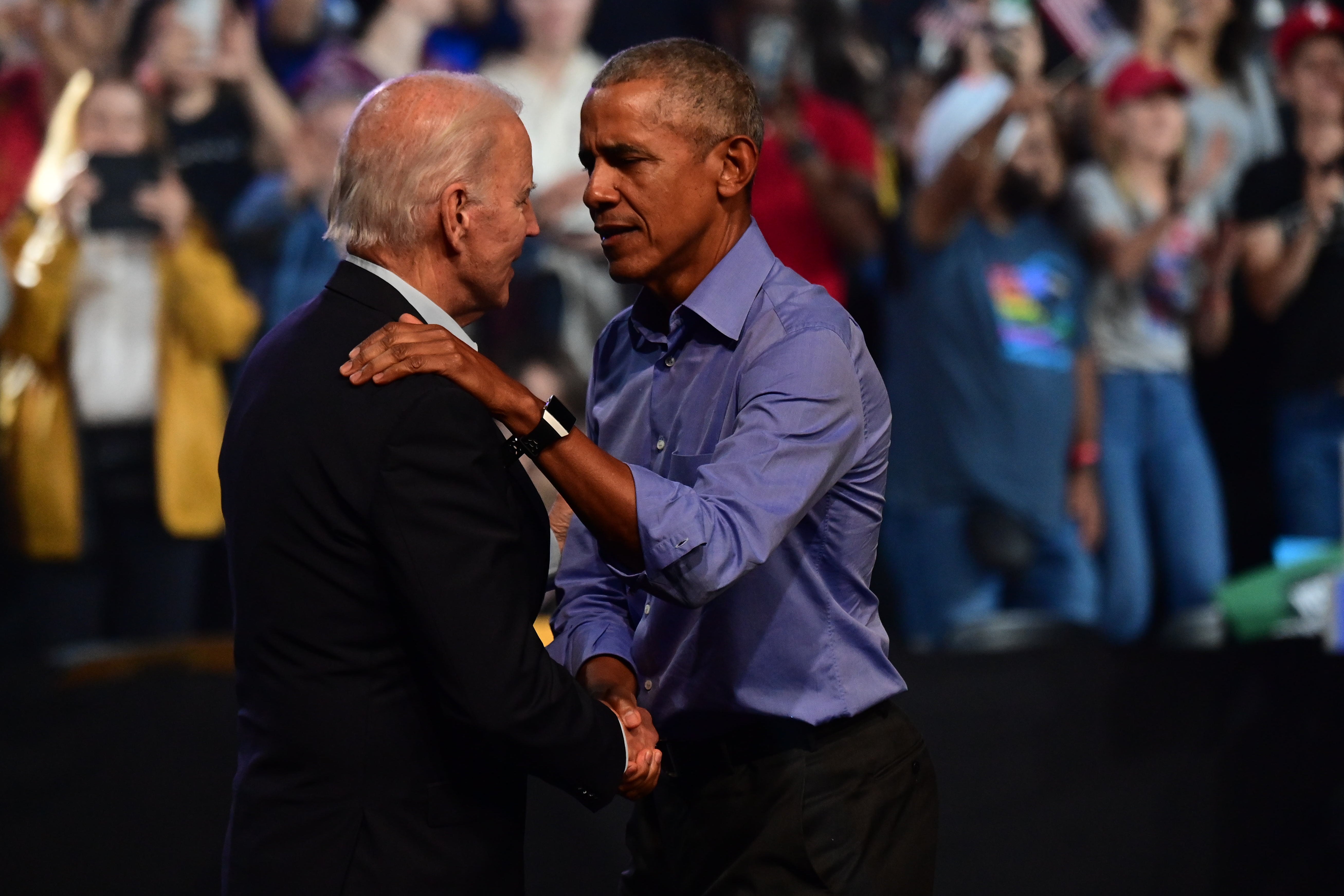 President Joe Biden and former President Barack Obama embrace on stage during a rally at the Liacouras Center on November 5, 2022, in Philadelphia, Pennsylvania. Obama reportedly didn’t object to George Clooney’s recent op-ed telling Biden to step aside