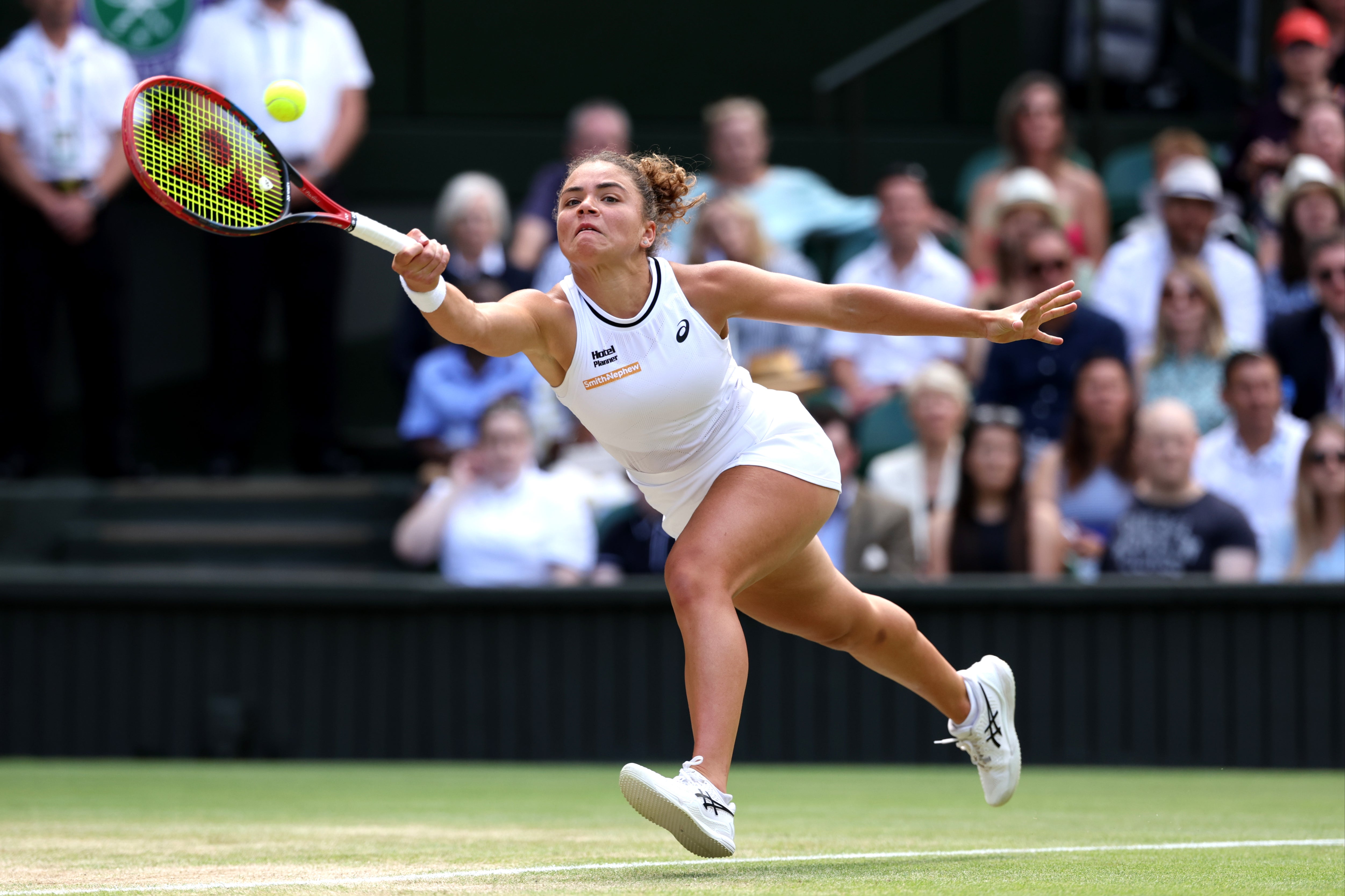 Jasmine Poalini stretches to play a shot against Donna Vekic