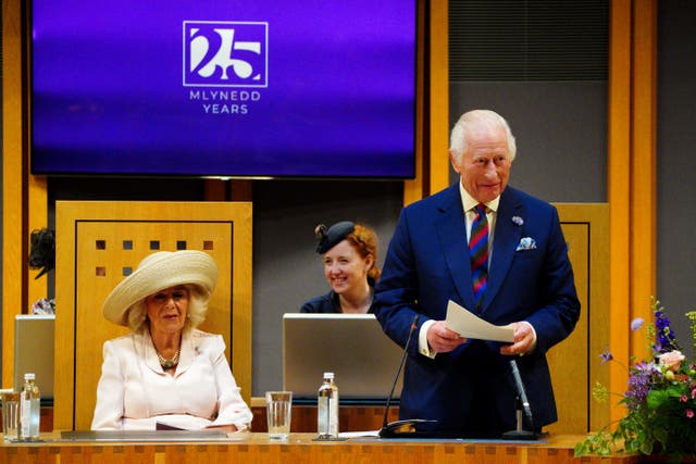 The King addressing the Senedd in Cardiff as Queen Camilla looks on (Ben Birchall/PA)