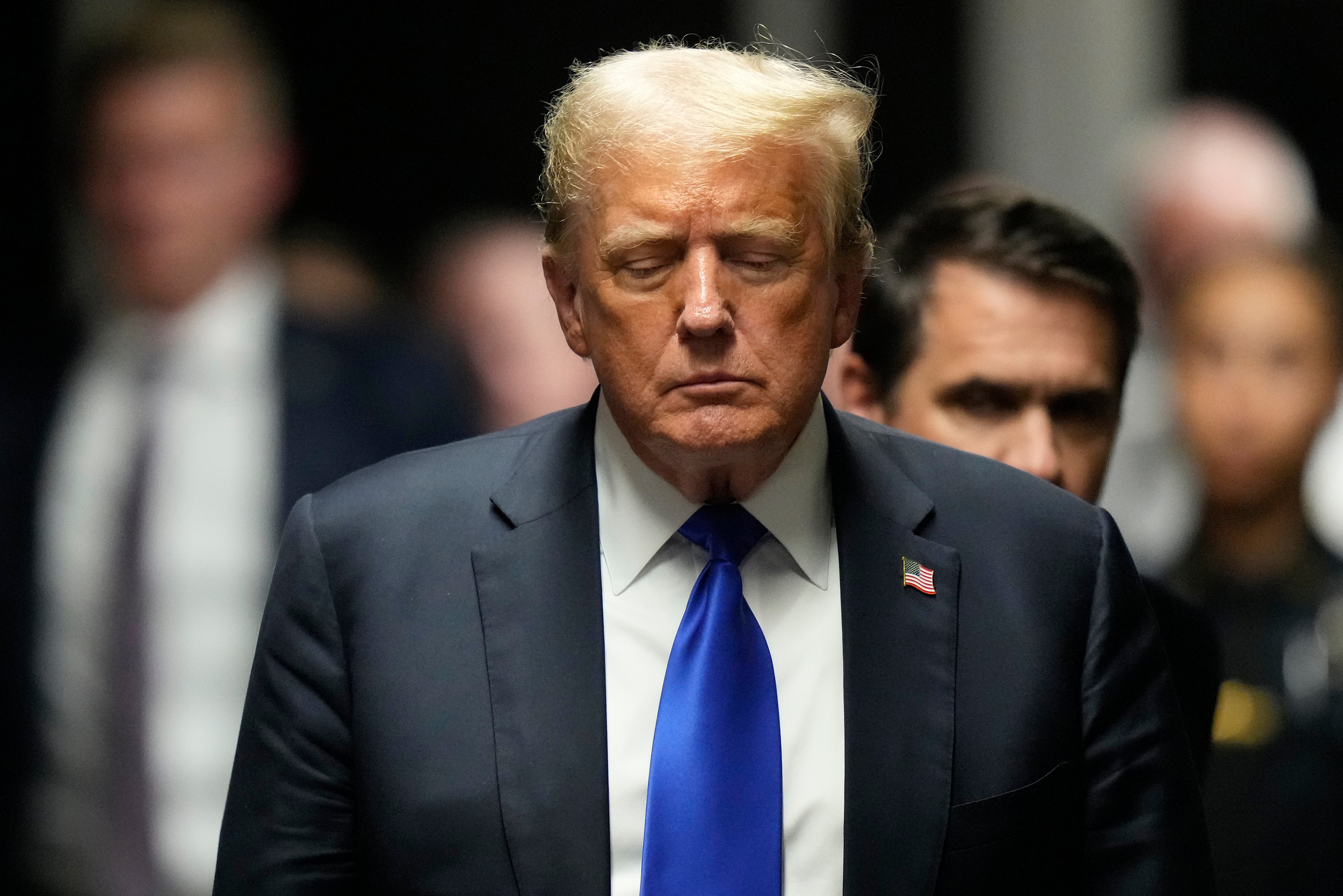 Donald Trump leaves a courtroom in Manhattan after a jury convicted him of felony crimes for falsifying business records in a scheme to illegally influence the 2016 election on May 30.