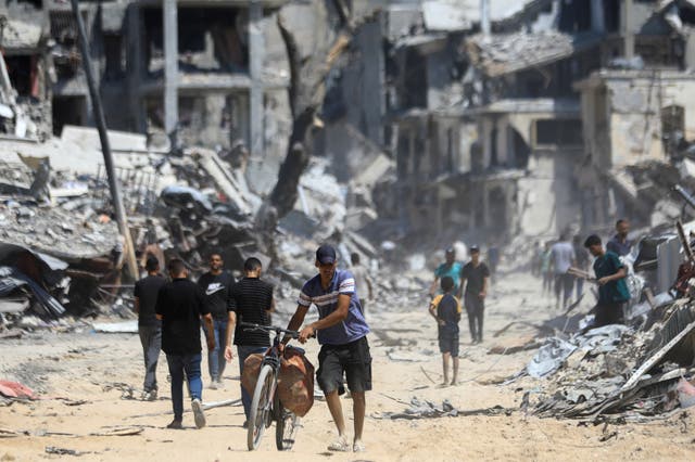<p>Palestinians in Gaza City</p>