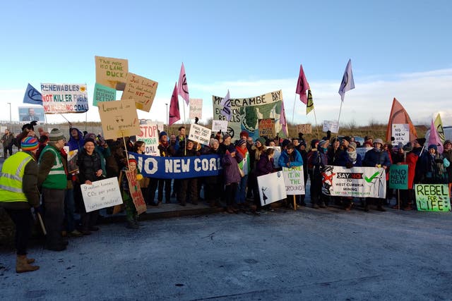 Protesters outside the proposed site of the new coal mine in Cumbria in 2022 (Friends of the Earth/PA)