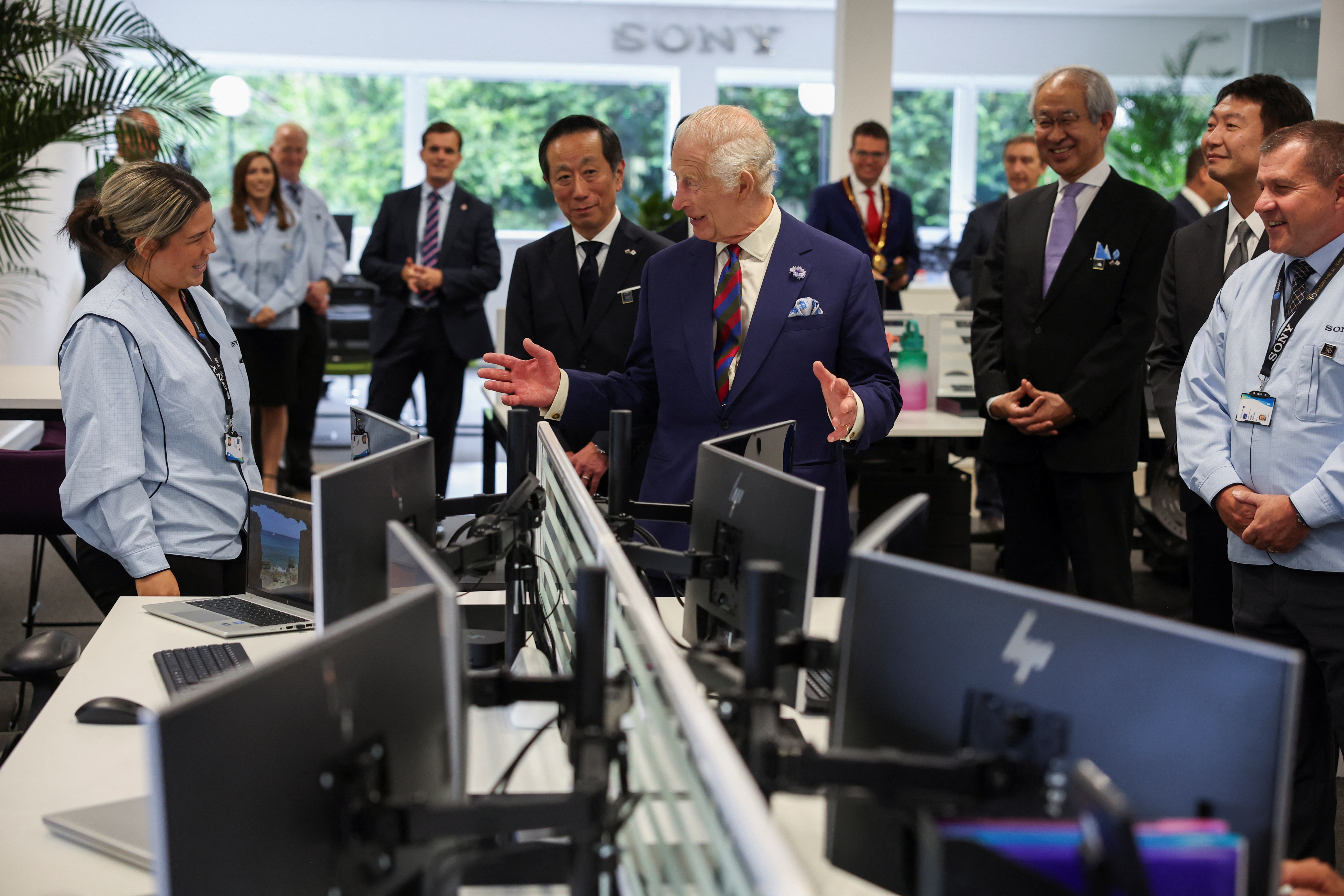 The King speaks to office staff during a visit to the Sony UK Technology Centre in Bridgend (Phil Noble/PA)