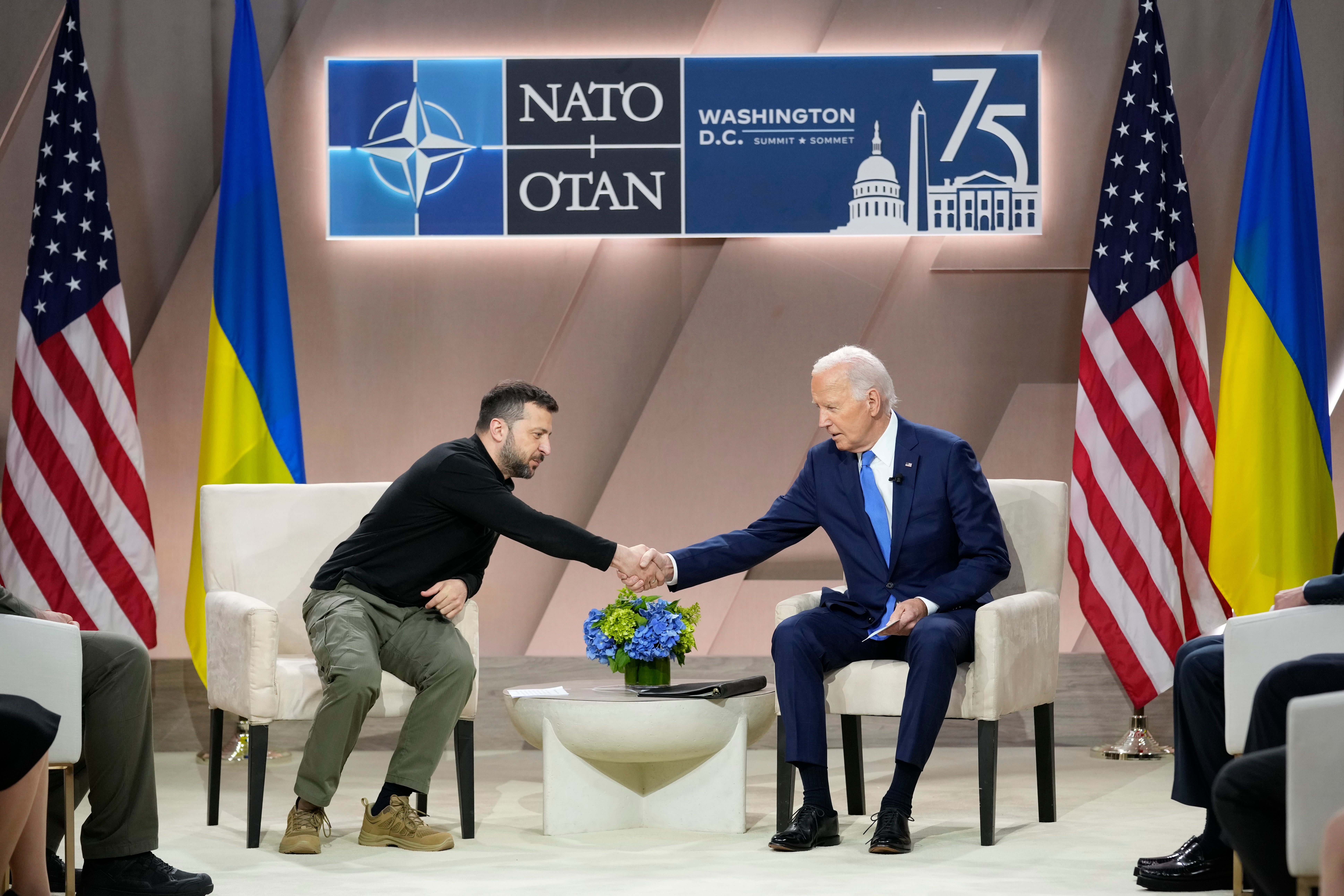 President Joe Biden, right, shakes the hand of Ukraine's President Volodymyr Zelenskyy during a meeting on the sidelines of the NATO Summit in Washington, Thursday, July 11, 2024