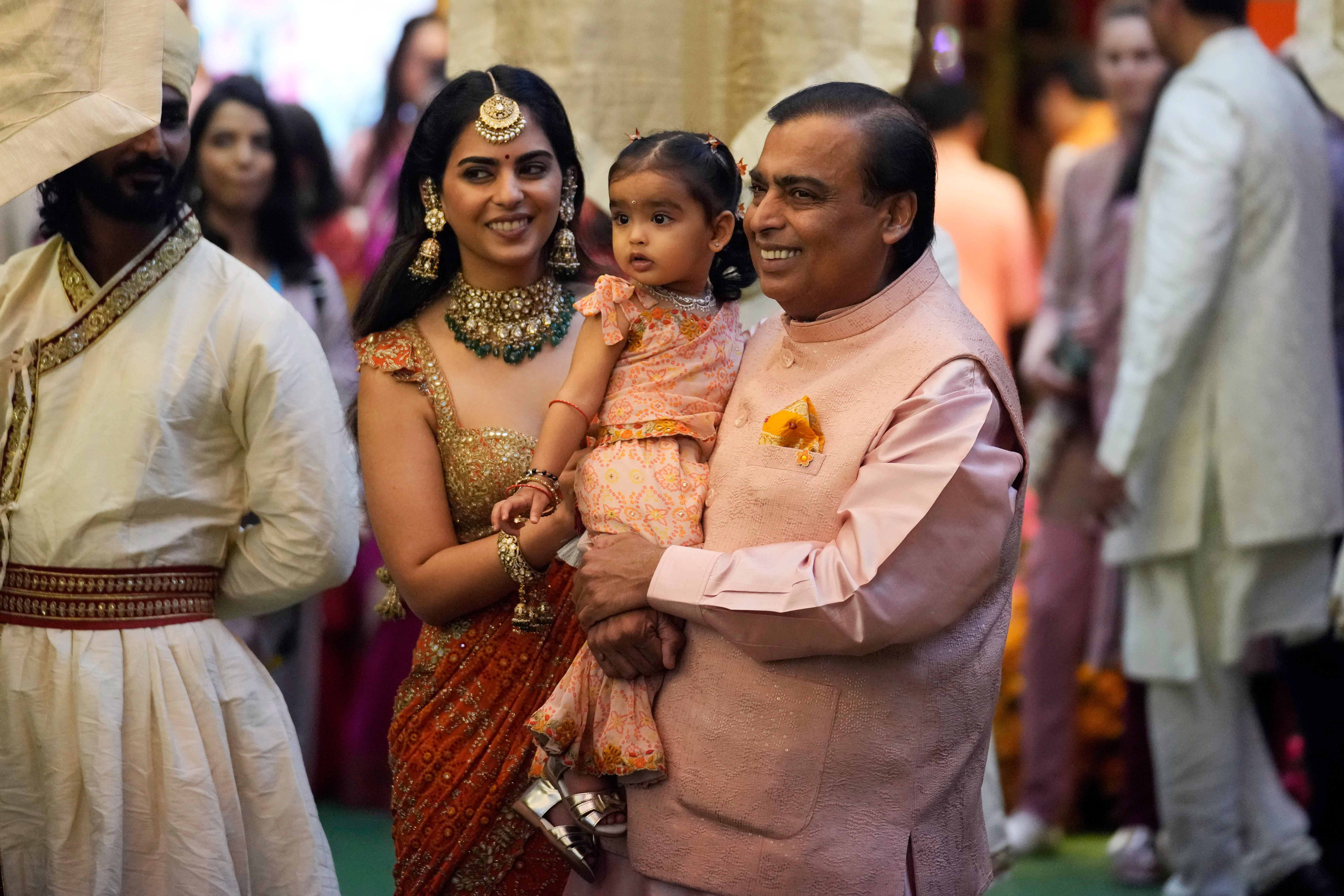 Mukesh Ambani with his daughter Isha Ambani and her children at a pre-wedding ceremony for Anant Ambani and Radhika Merchant
