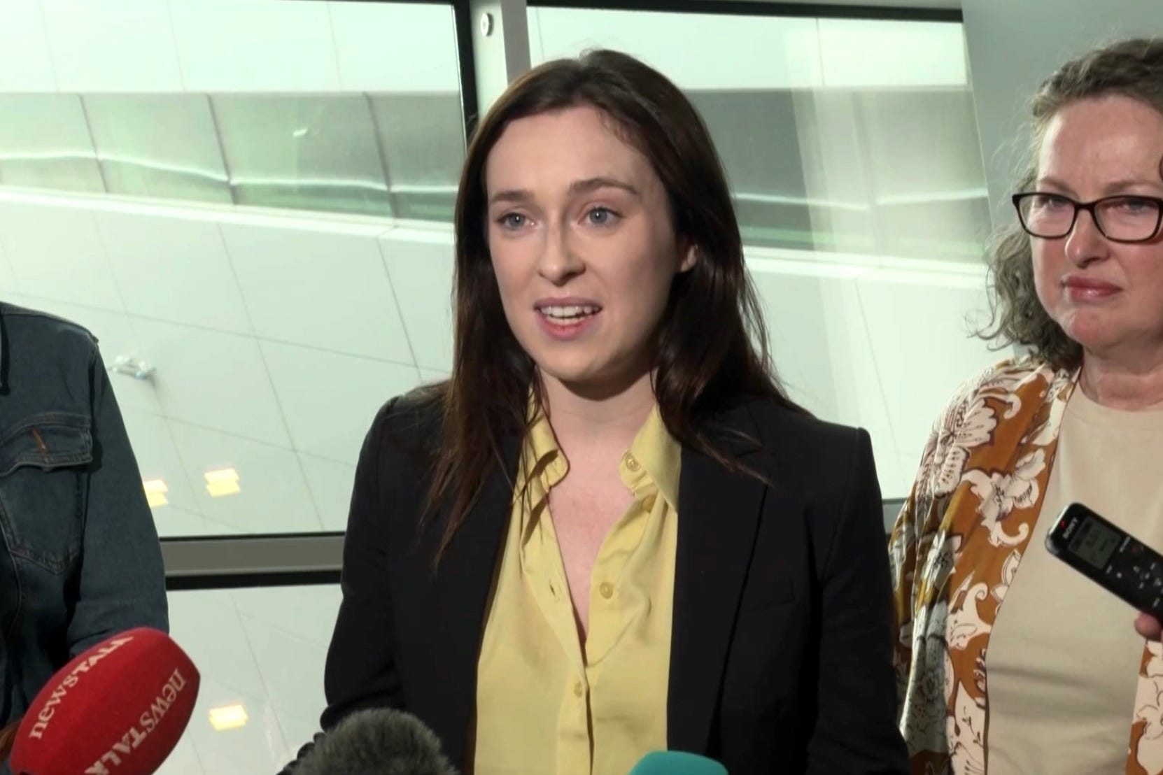 Tori Towey speaking to media after arriving home to Dublin Airport with her aunt, Ann Flynn (left) and her mother Caroline (David Young/PA)