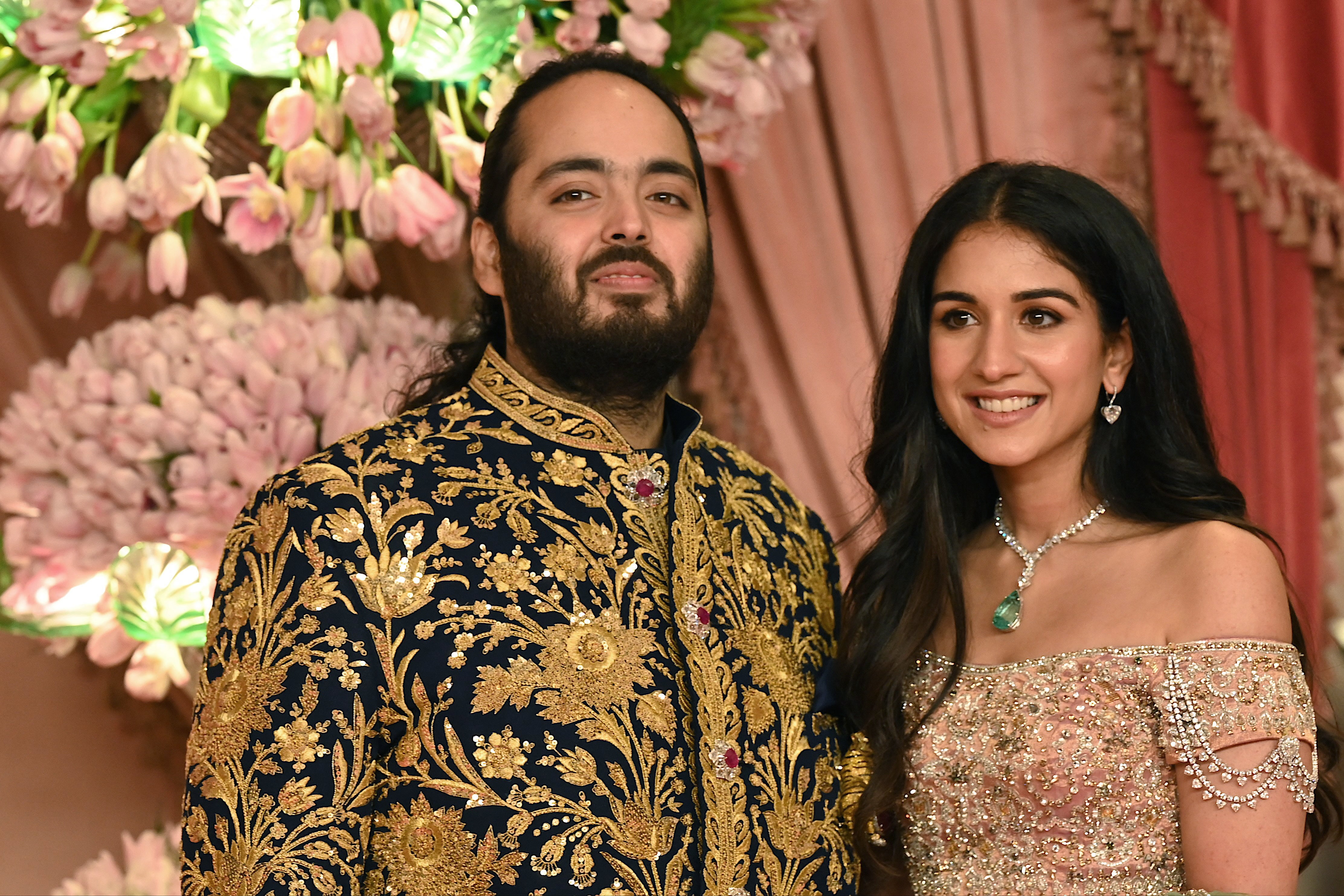 Anant Ambani with his fiancee Radhika Merchant pose for a picture during their Sangeet ceremony in Mumbai on 5 July