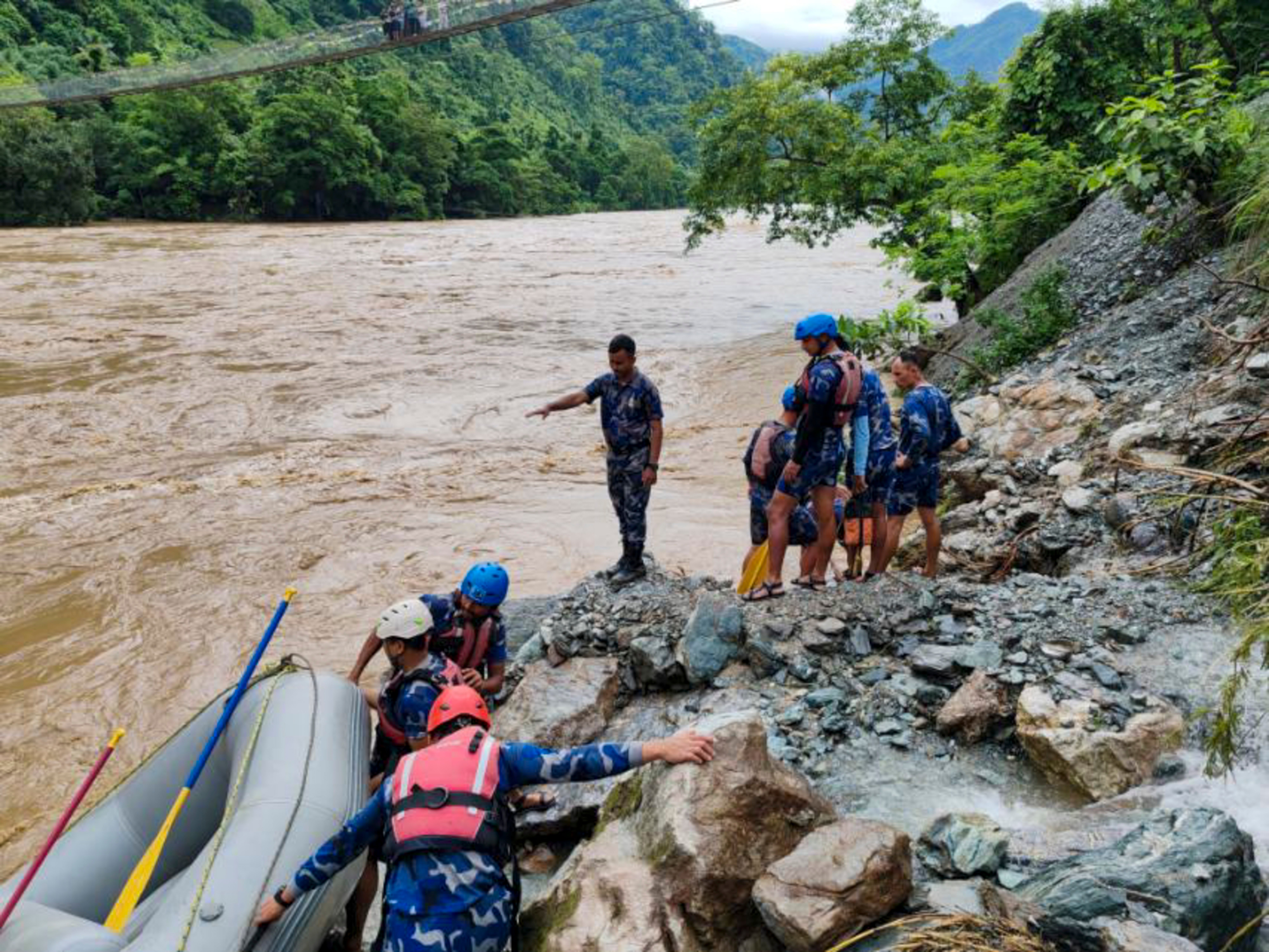 At least 60 people are missing after a landslide knocked passenger buses off a highway and into a swollen river