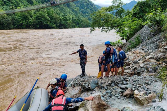 <p>At least 60 people are missing after a landslide knocked passenger buses off a highway and into a swollen river </p>