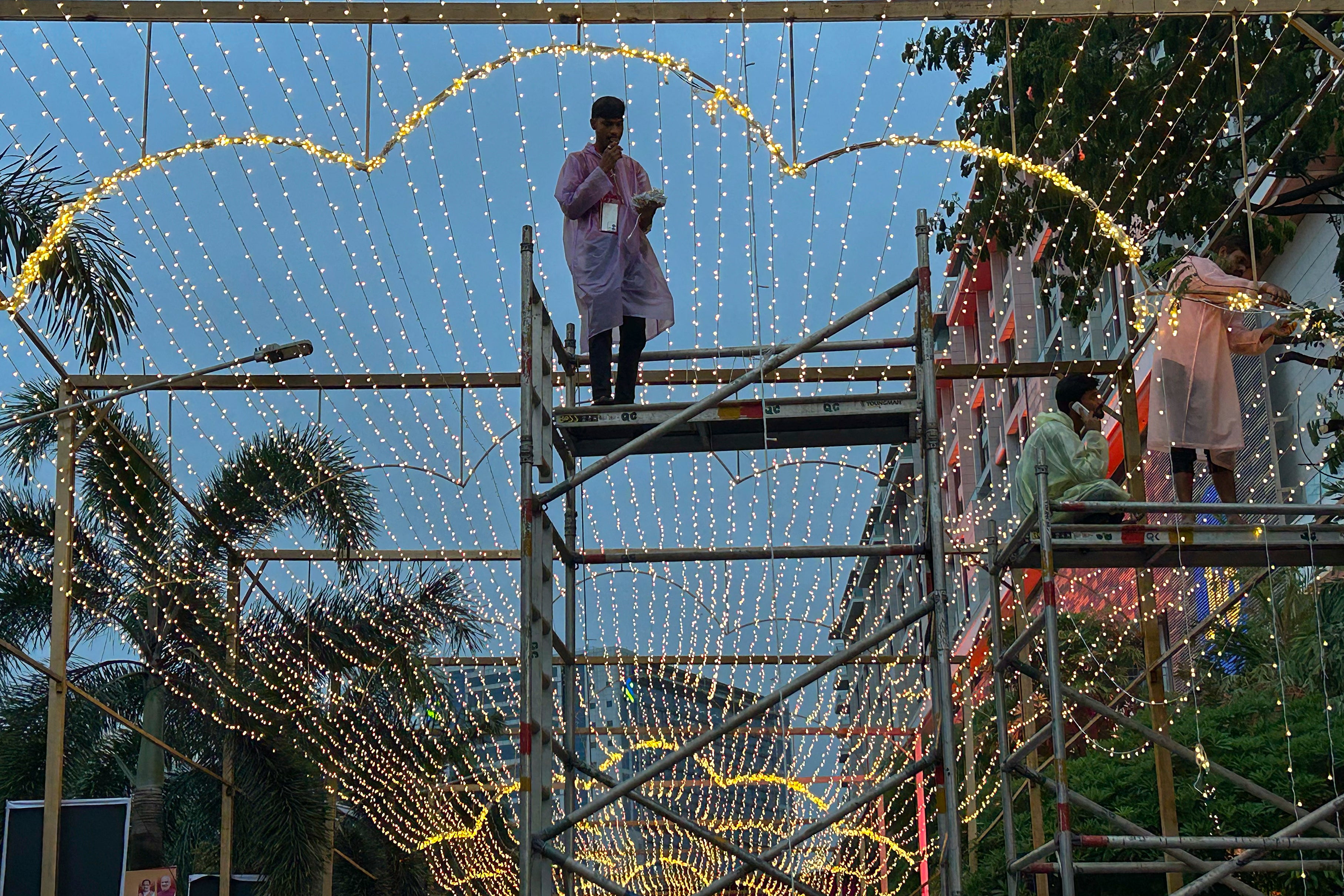 Workers decorate the venue