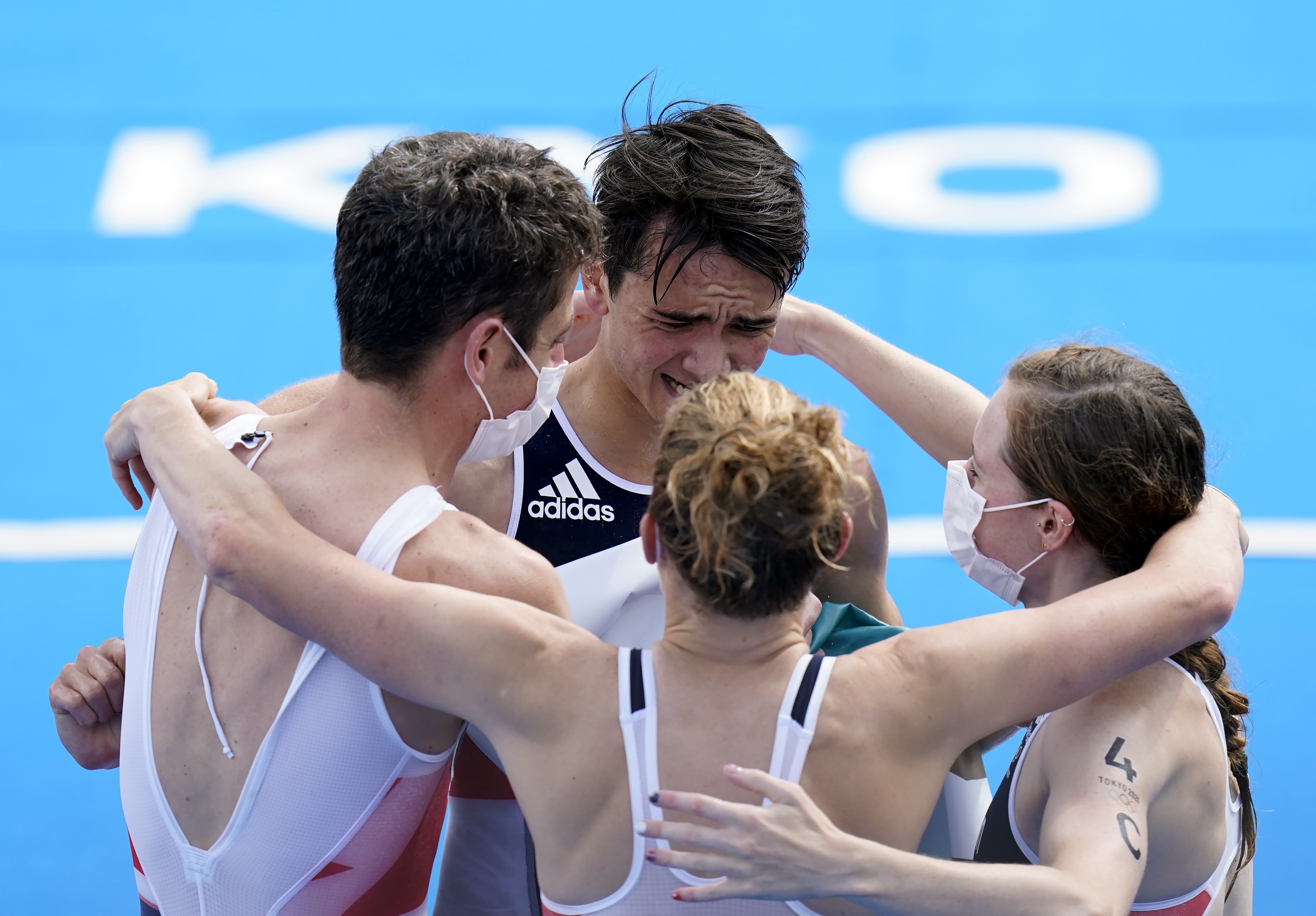 Yee, second left, is congratulated by his relay team-mates, including Jonny Brownlee, left, after winning gold in Tokyo (Danny Lawson/PA)