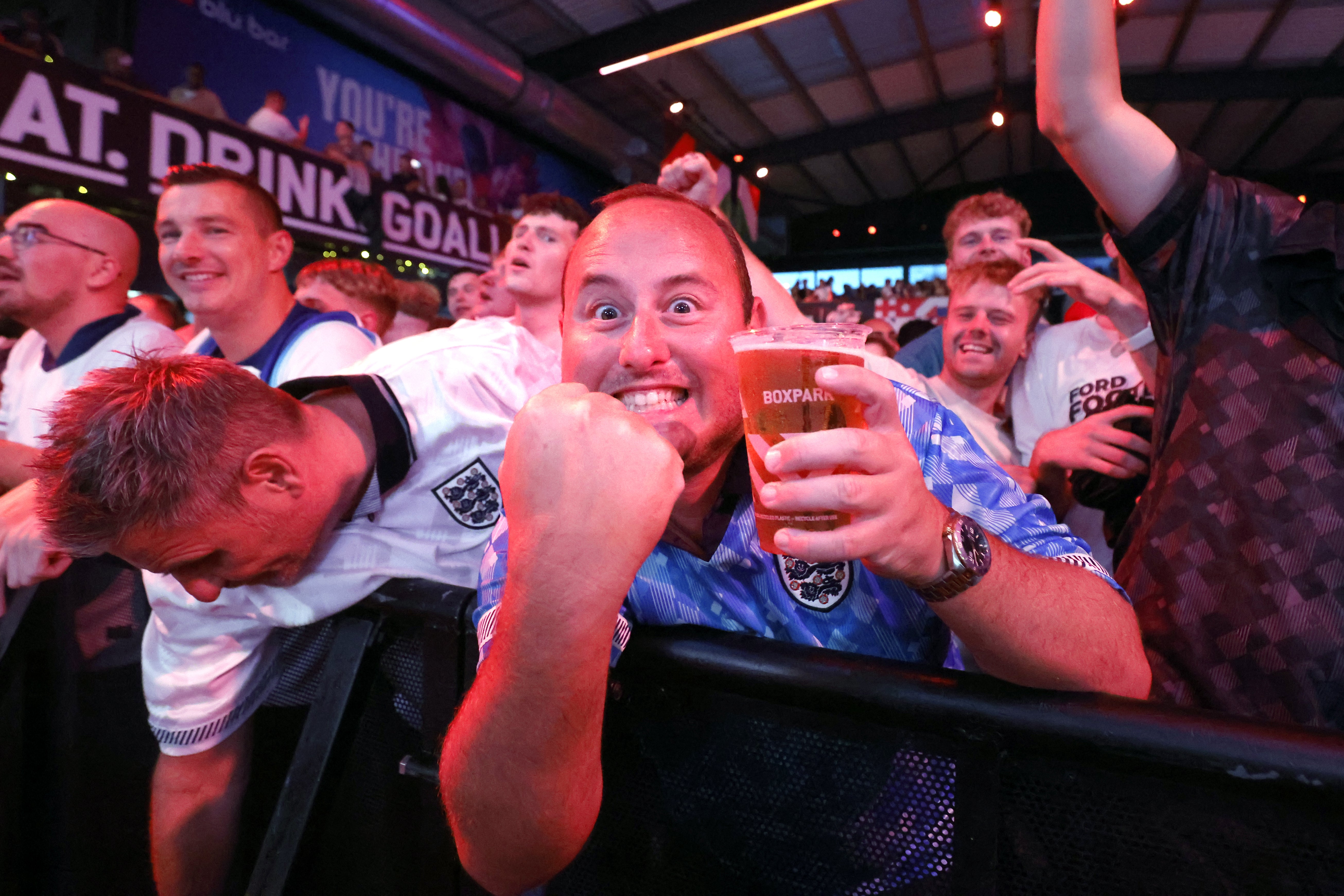 England fans celebrate at BOXPark Wembley, London, after a screening of the UEFA Euro 2024, semi final match, between England and the Netherlands (Nigel French/PA)