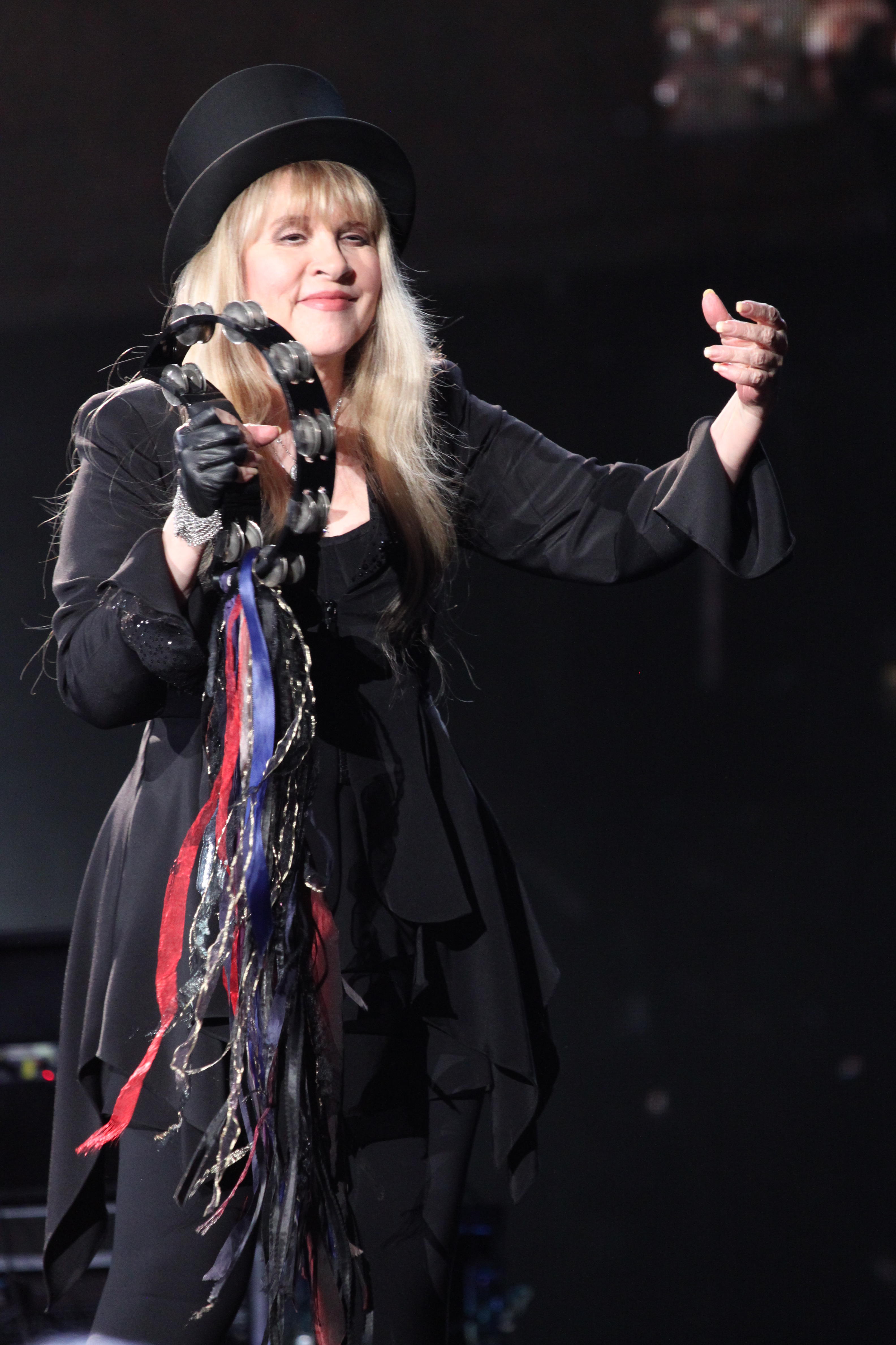 Stevie Nicks now often sports all-black ensembles adorned with ribbons, frills and trims (Alamy/PA)