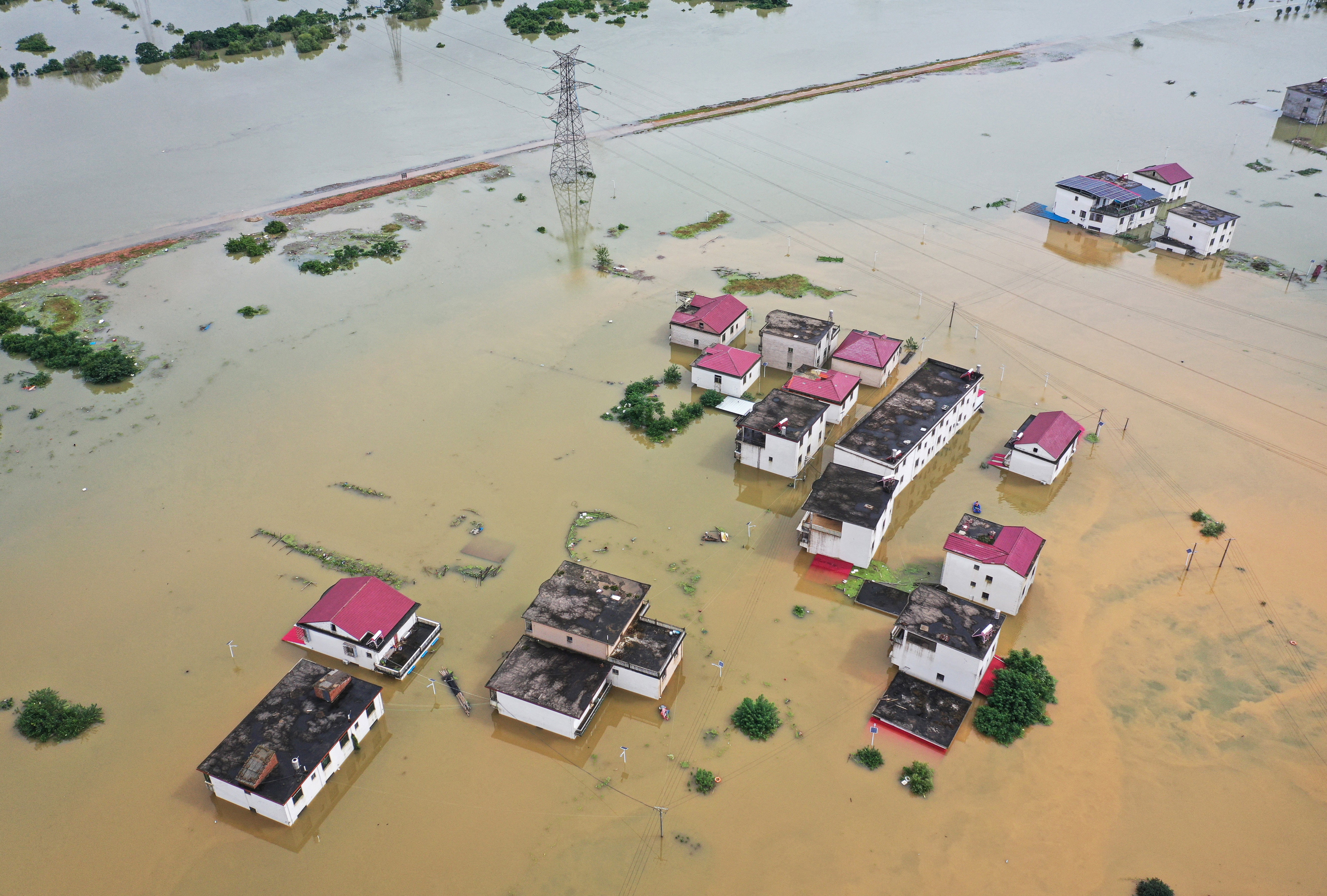 <p>Aerial photo shows submerged houses after a flood in Jiujiang in central China's Jiangxi on 2 July 2024  </p>