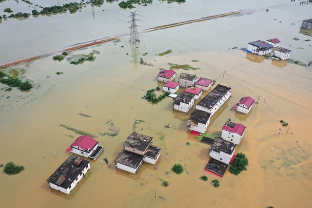 <p>Aerial photo shows submerged houses after a flood in Jiujiang in central China's Jiangxi on 2 July 2024  </p>