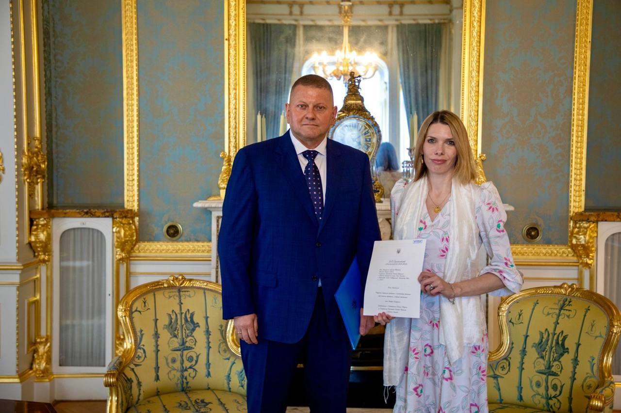 Valery Zaluzhnyi is pictured with foreign office official Victoria Busby in the Ukrainian embassy