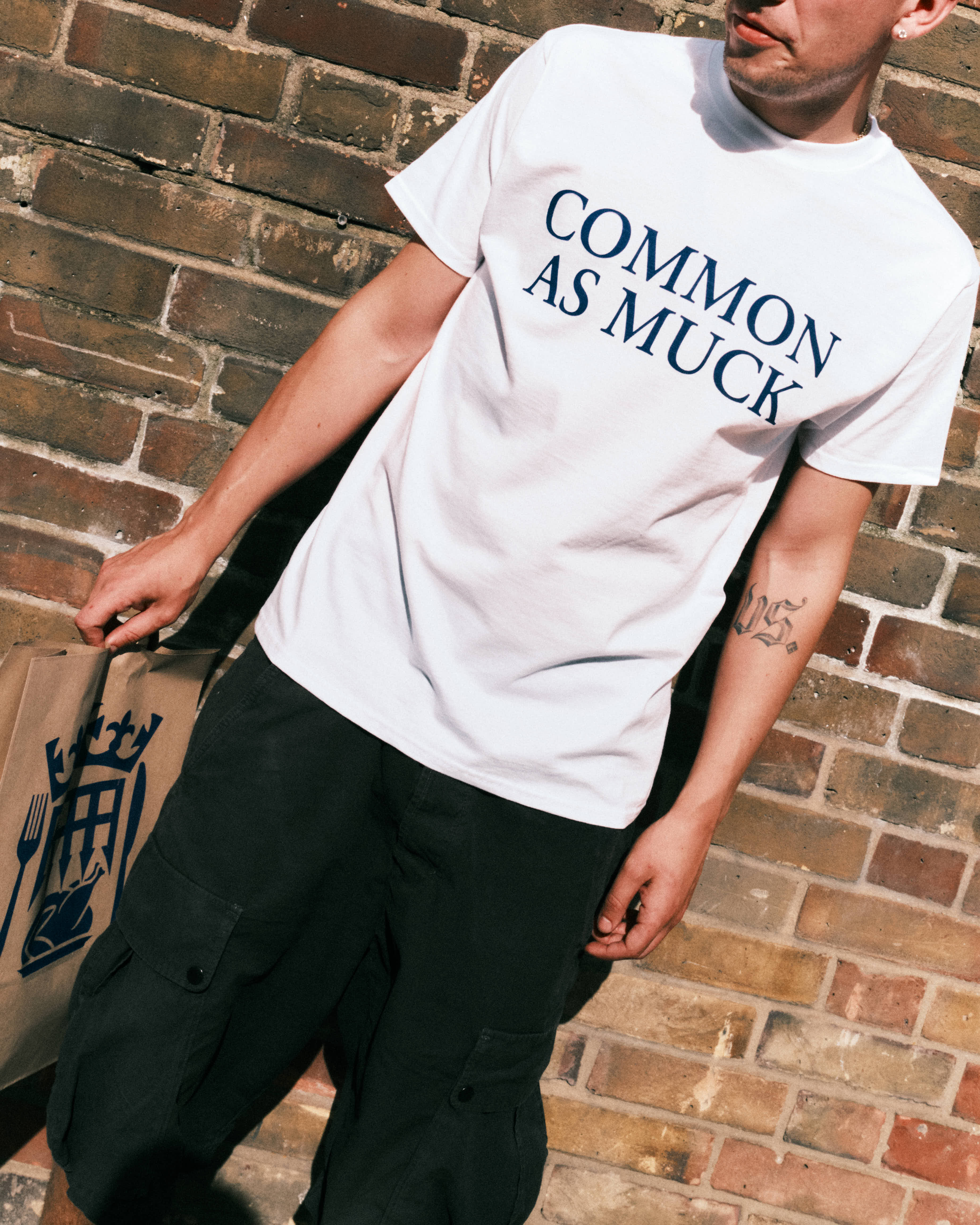 The campaign features a range of slogan T-shirts produced by the British artist Corbin Shaw
