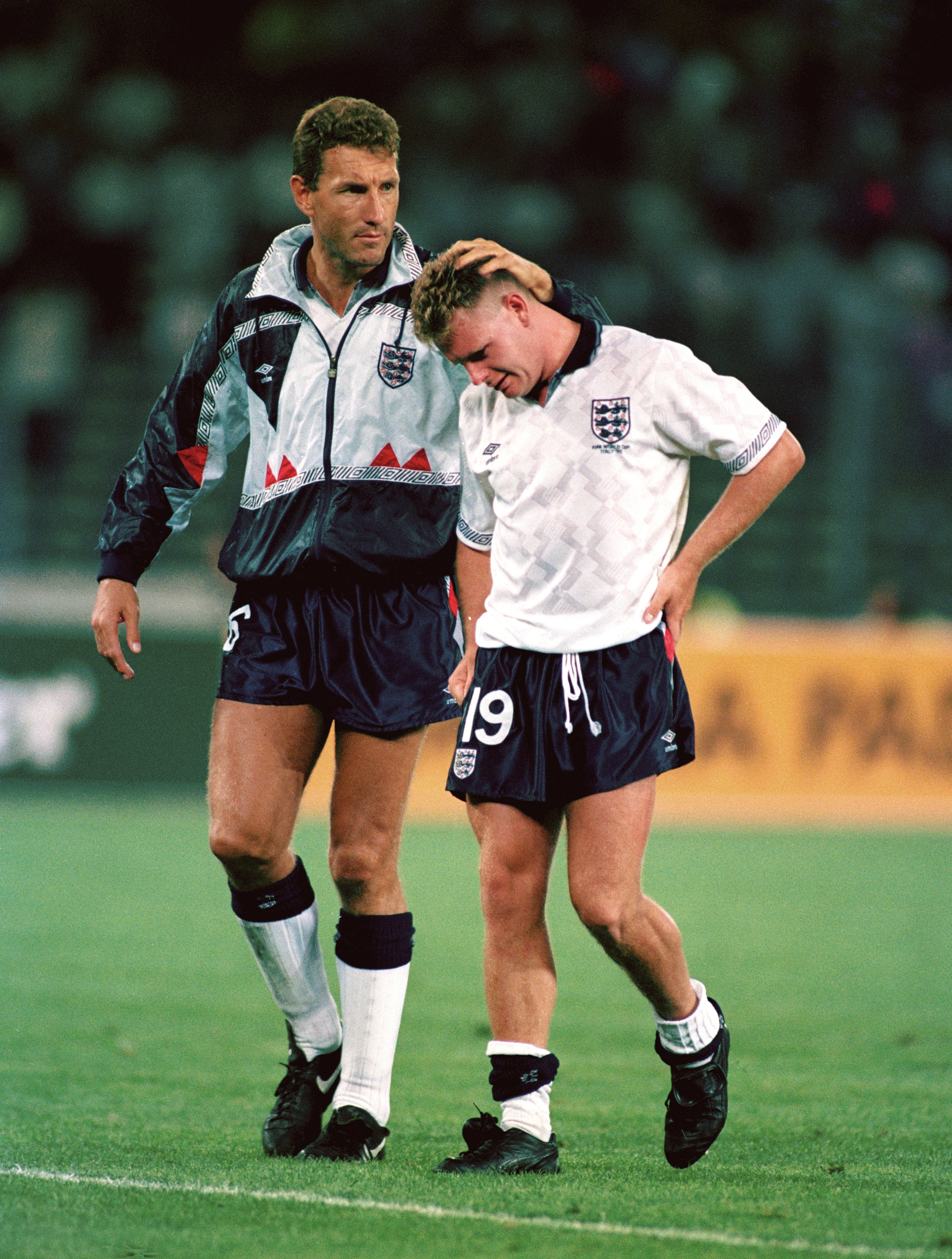 Paul Gascoigne is consoled by Terry Butcher after the 1990 FIFA World Cup Semi Final