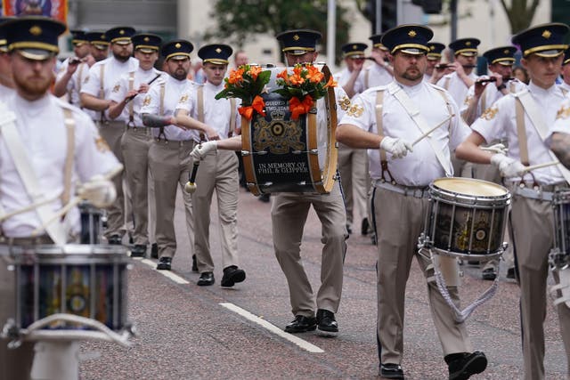 People take part in an Orange Order parade in Belfast as part of the ‘Twelfth of July’ celebrations (Brian Lawless/PA)