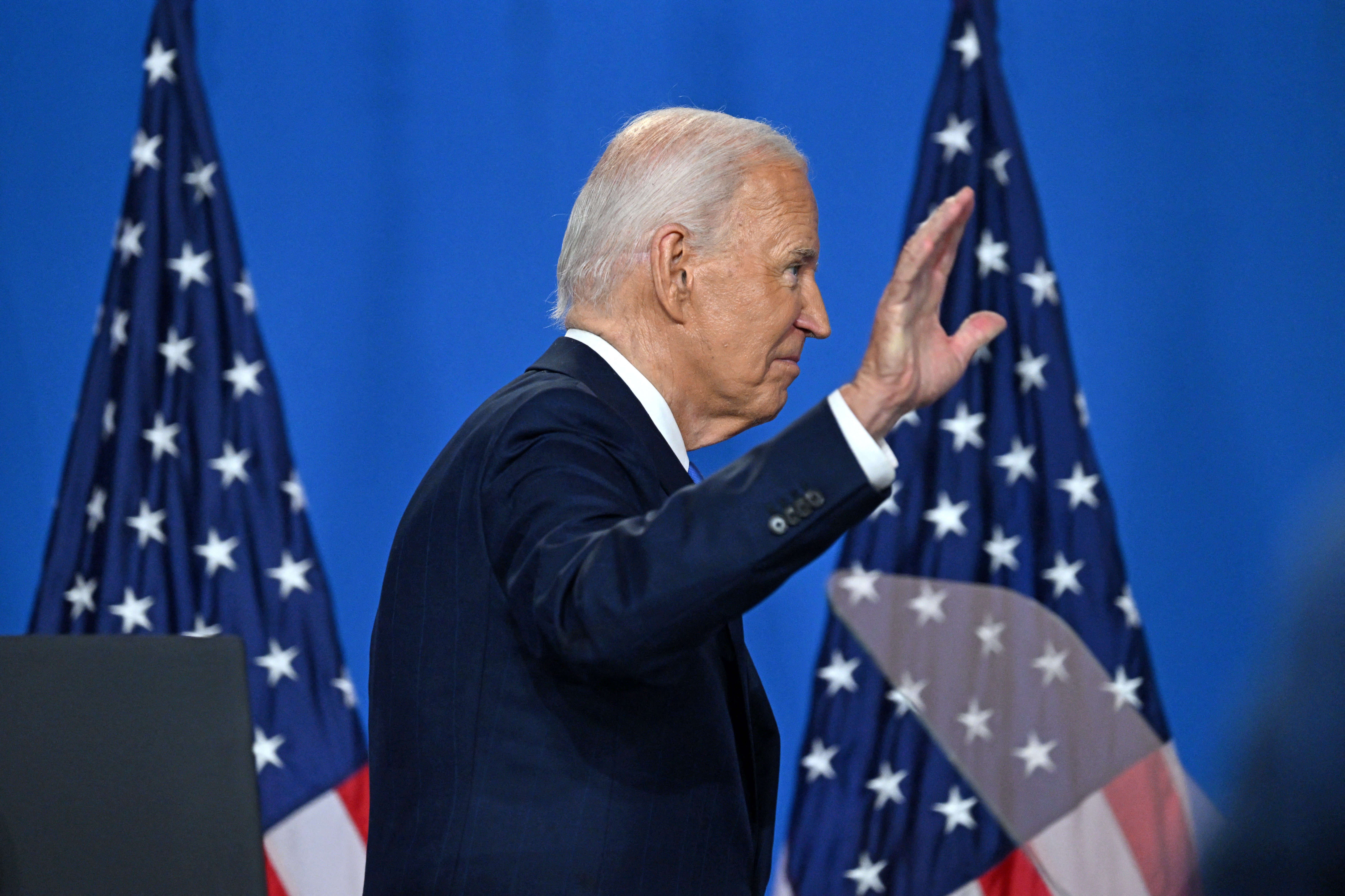 Joe Biden waves as he leaves after speaking during a press conference at the close of the 75th NATO Summit on July 11. Major donors are holding back as long as he remains on the ticket