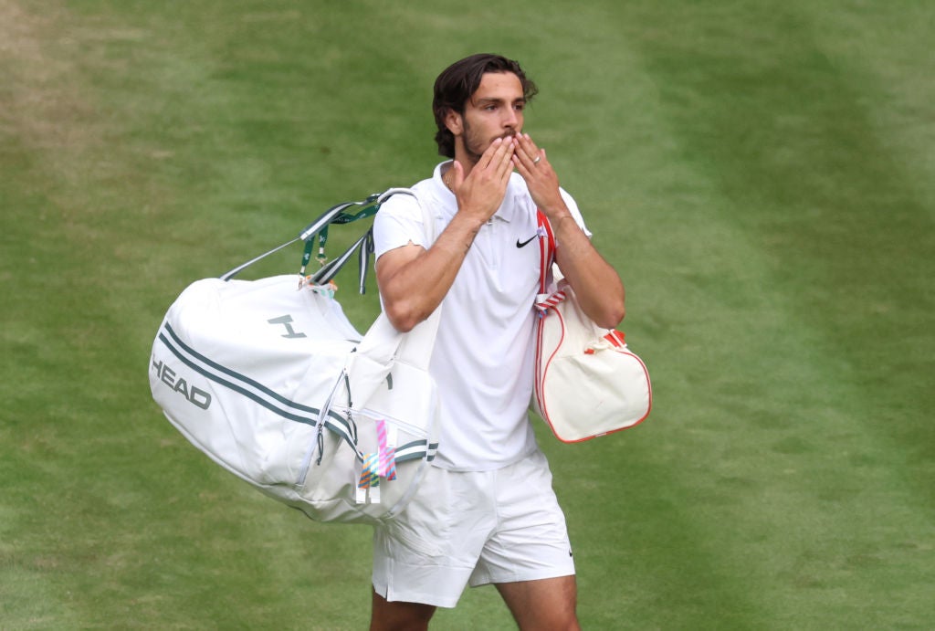 Musetti departs Centre Court after a straight-sets defeat