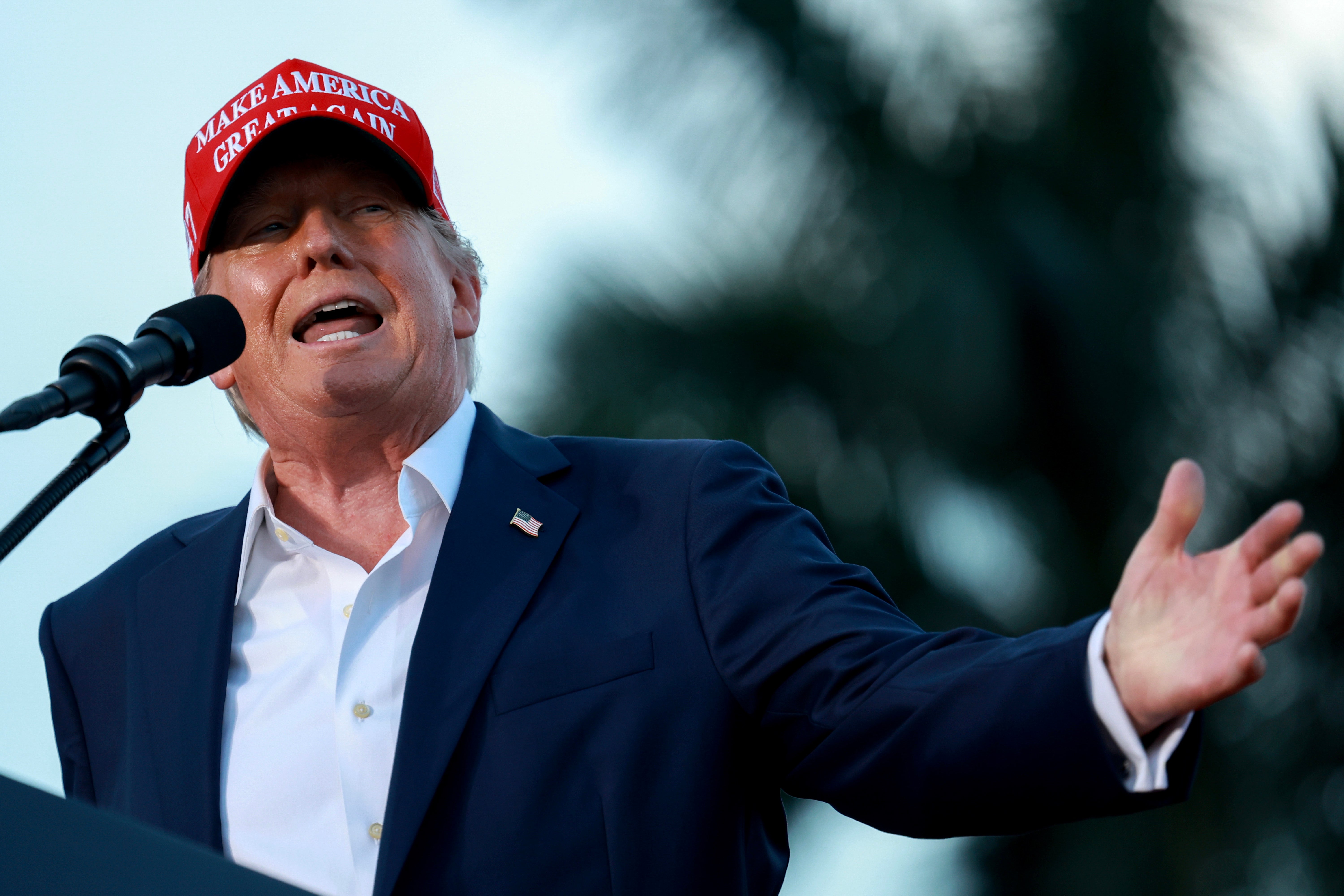 Former President Donald Trump speaks during his campaign rally at the Trump National Doral Golf Club on July 09, 2024 in Doral, Florida. On Friday, he slammed George Clooney for his New York Times op-ed calling on Joe Biden to step aside