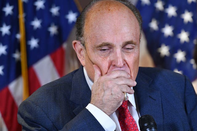 <p>Rudy Giuliani speaks at a press conference at the Republican National Committee headquarters in 2020. His false claims about election workers that year are central to a blockbuster defamation verdict against him.  He declared bankruptcy in 2023 shortly after he was ordered to pay $148m</p>