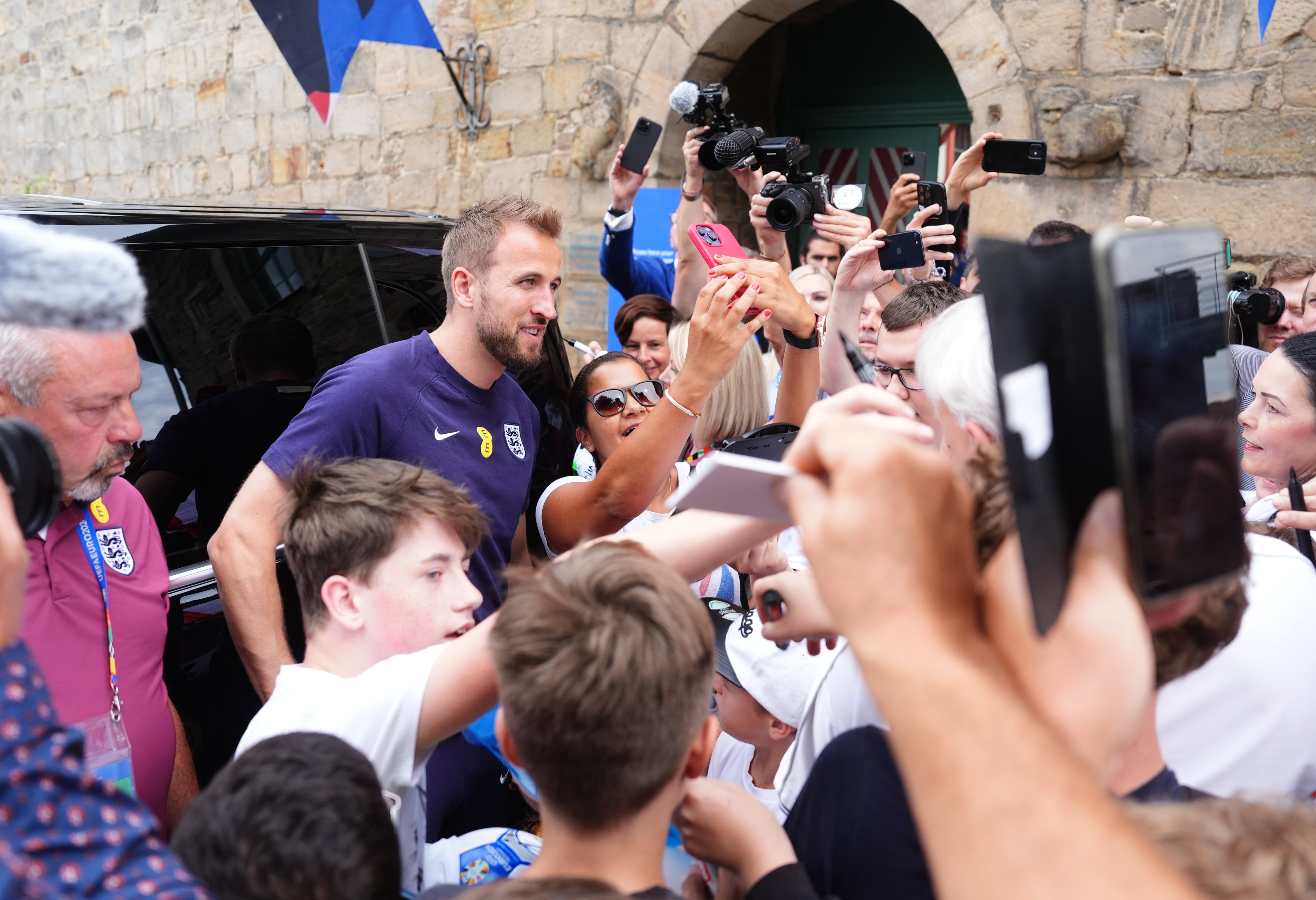 England captain Harry Kane met fans outside the team’s base in Blankenhain (Adam Davy/PA)