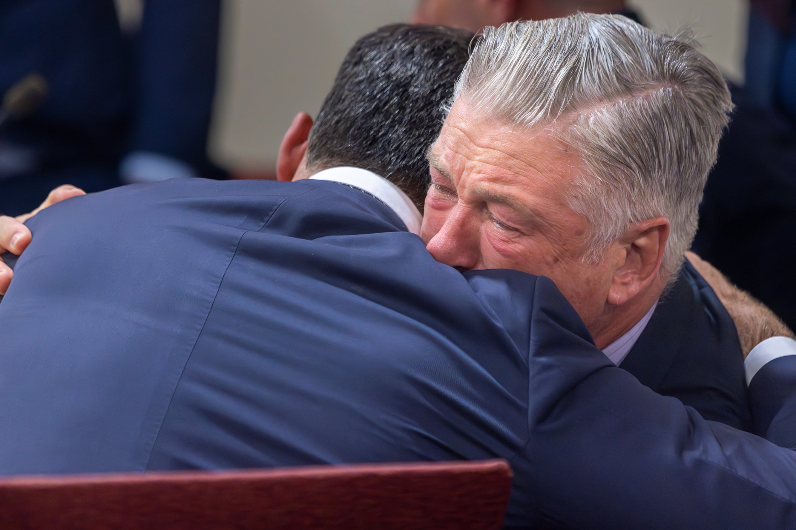 Actor Alec Baldwin, right, hugs his defense attorney Alex Spiro after District Court Judge Mary Marlowe Sommer threw out the involuntary manslaughter case on Friday