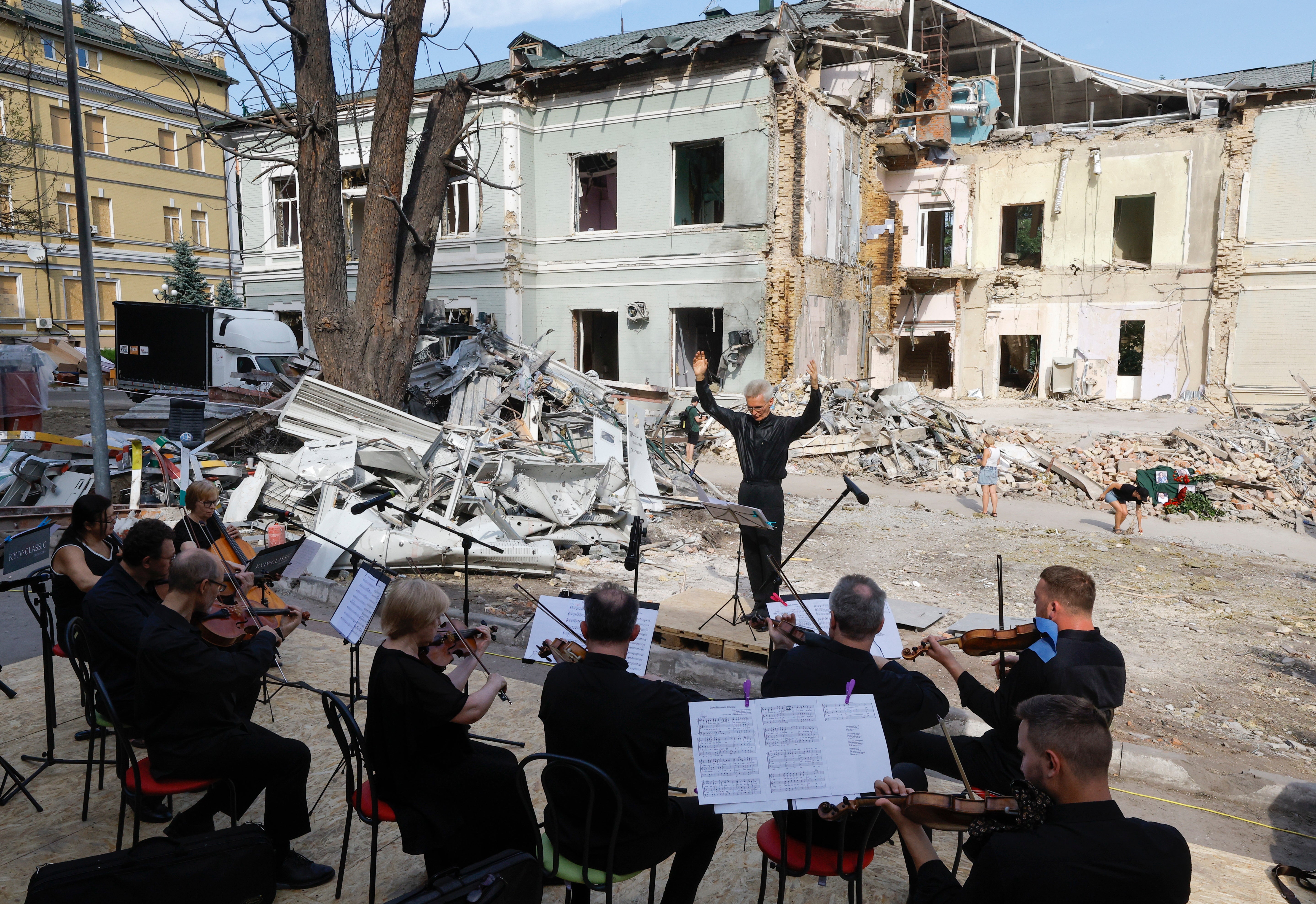 The Kyiv Classic Orchestra 'Kyiv-classic' performs during a 'Requiem for the Fallen' event honoring the memory of those who died as a result of a missile strike on the 'Okhmatdyt' children's hospital in Kyiv