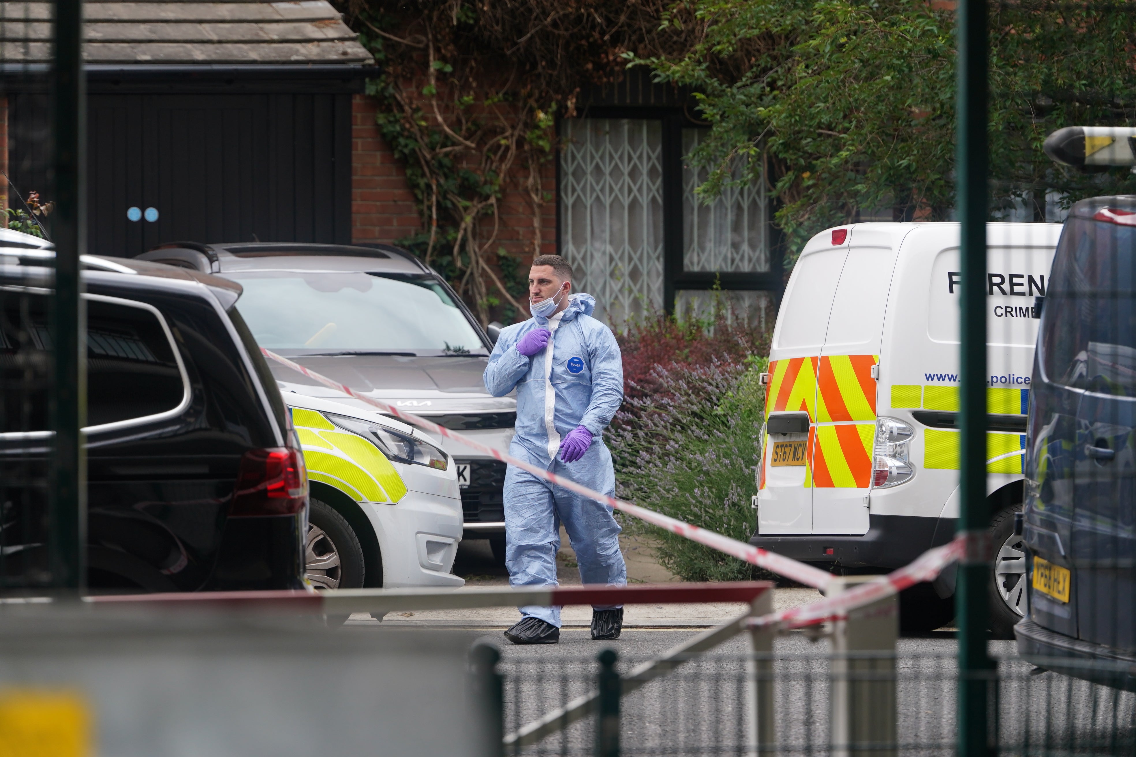 A forensic officer at an address in Shepherd’s Bush, west London, searches believed to be in connection with the human remains found in Bristol