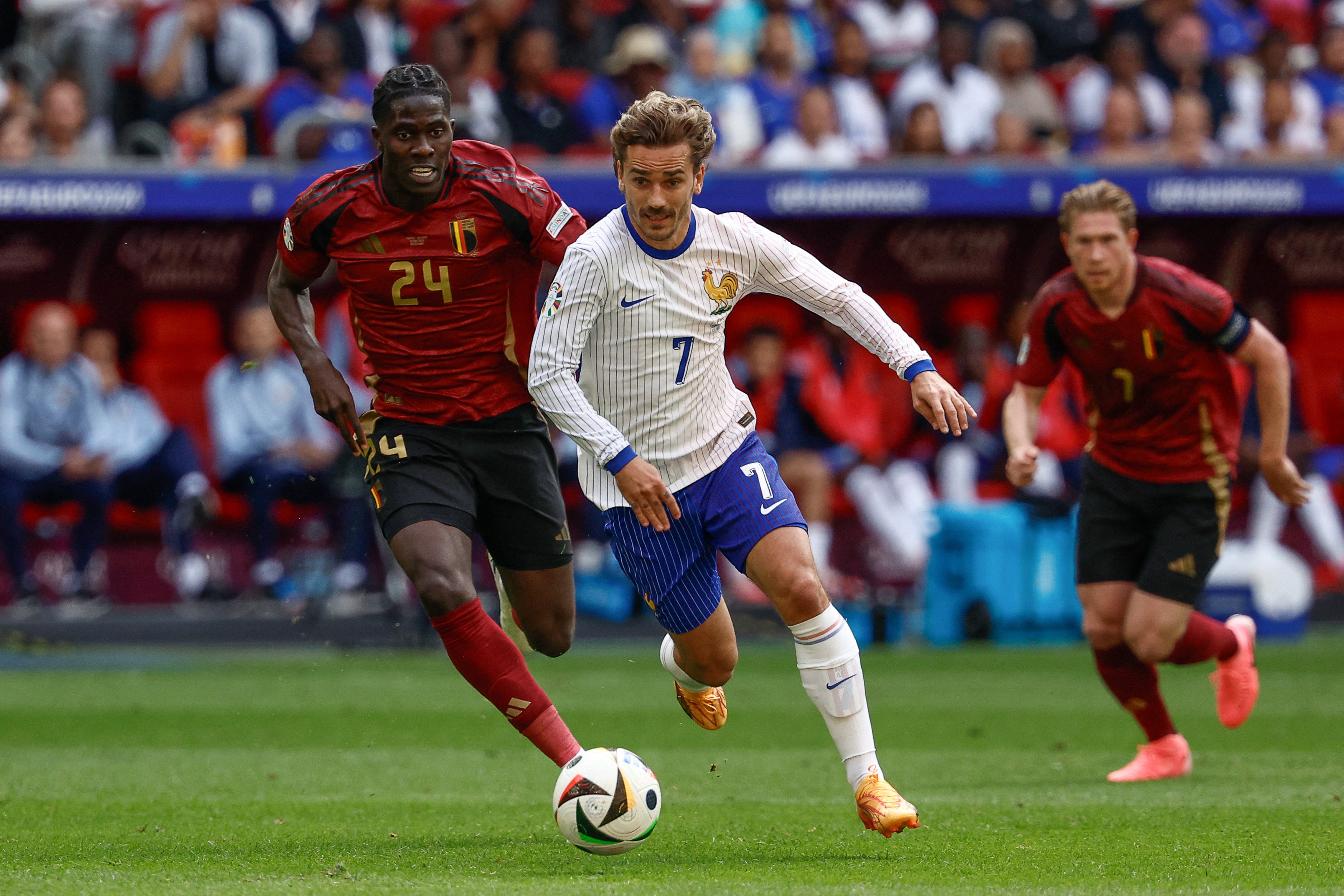 Antoine Griezmann is flanked by Amadou Onana at Euro 2024