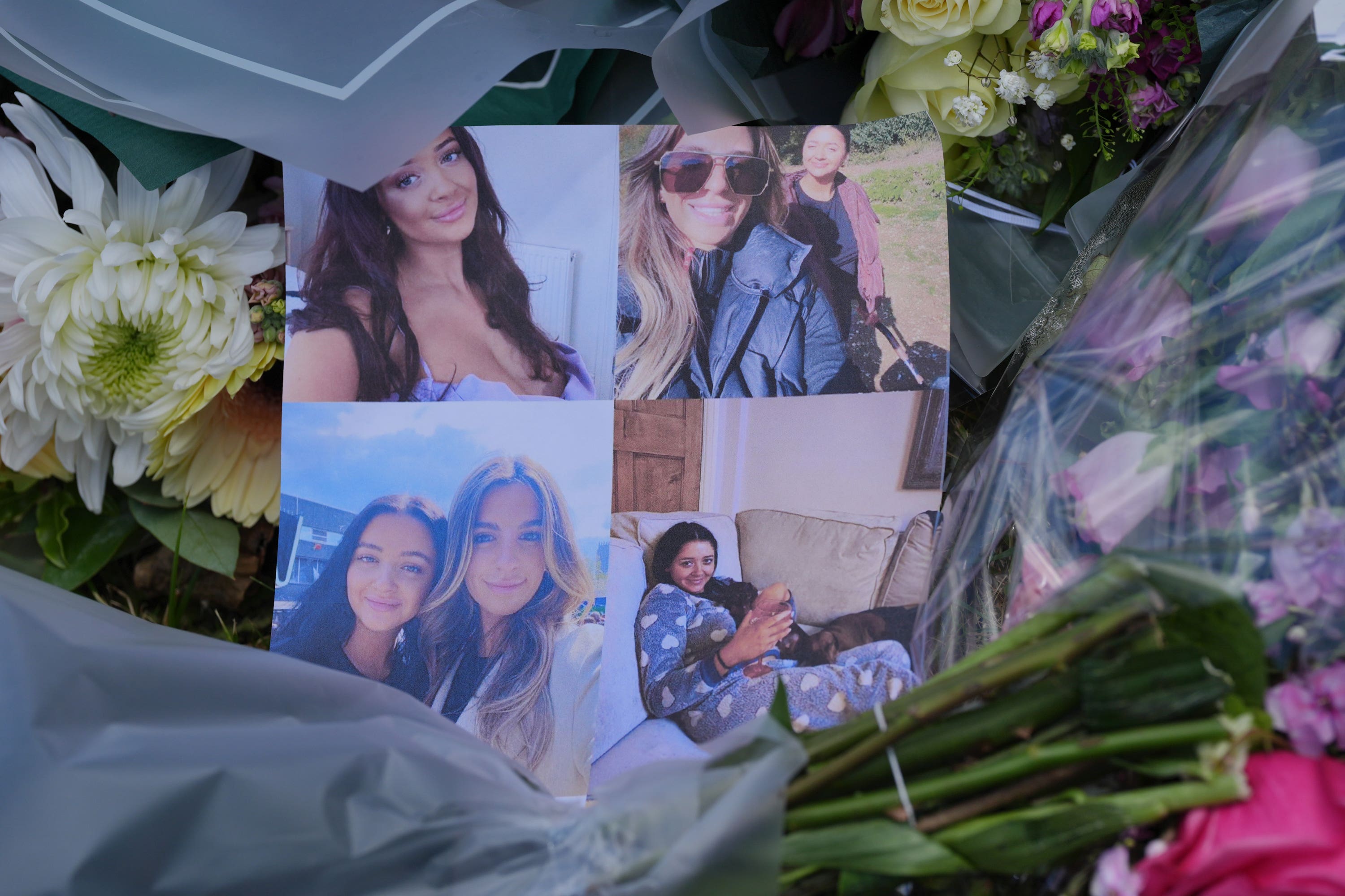 Pictures left on floral tributes at Ashlyn Close, Bushey, where the family were killed