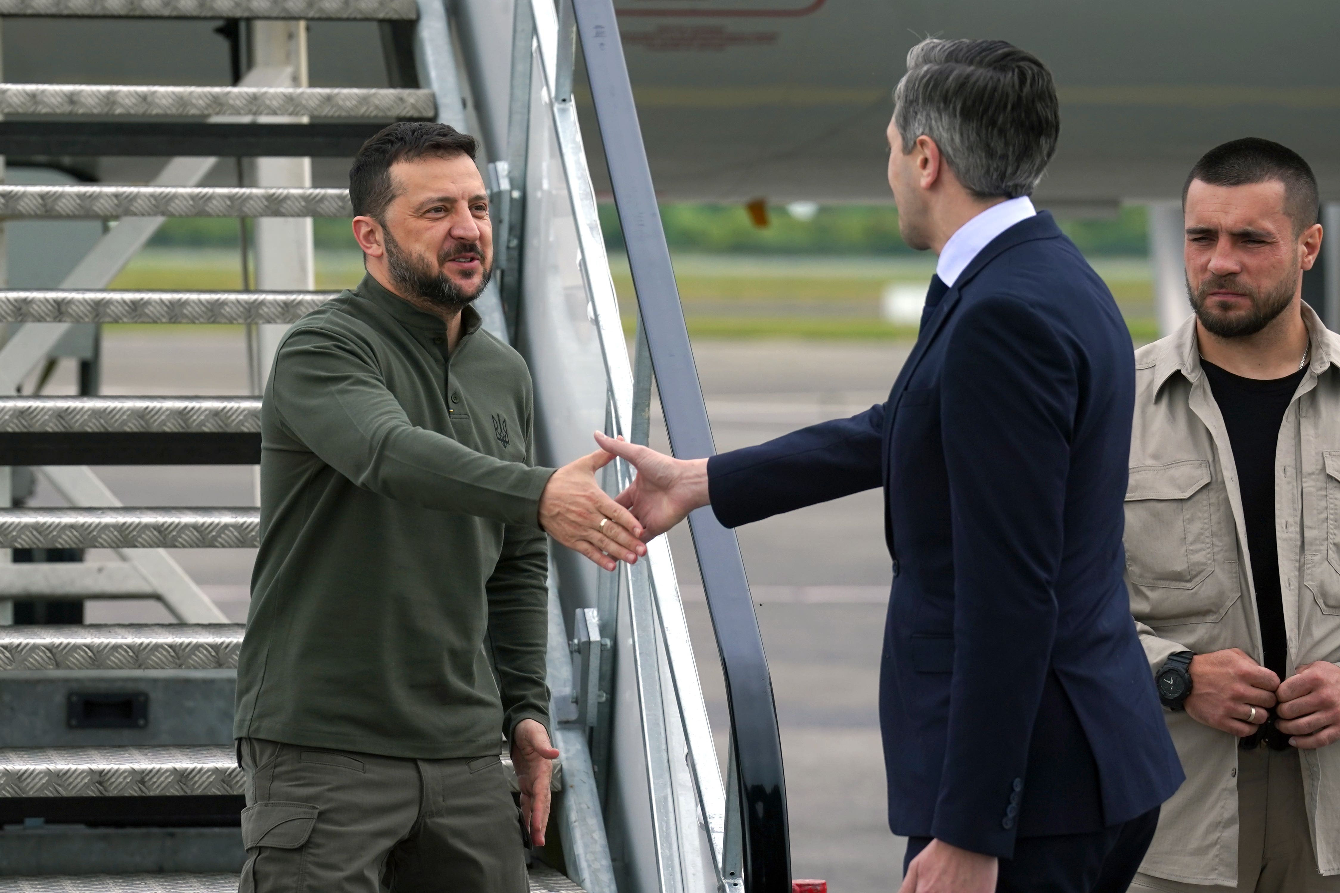 Taoiseach Simon Harris greets Ukrainian President Volodymyr Zelensky at Shannon Airport, Co Clare (Brian Lawless/PA)